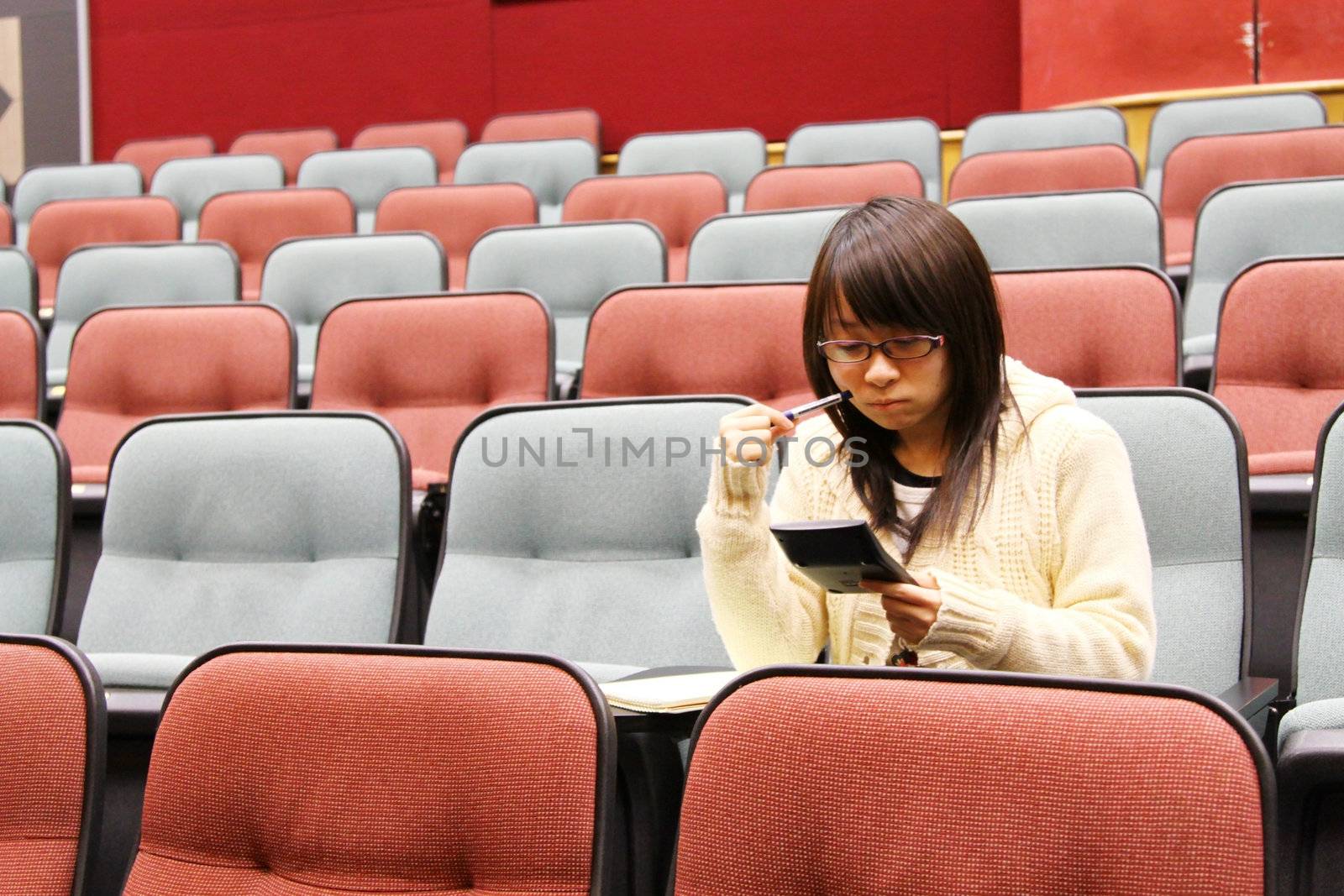 Asian student studying in lecture  by kawing921