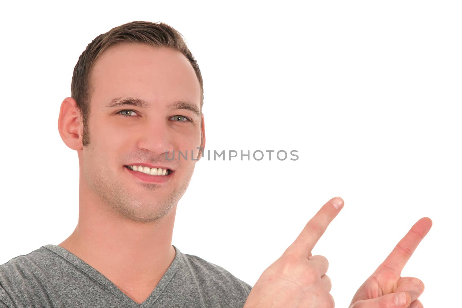 Smiling young man pointing upwards by Farina6000