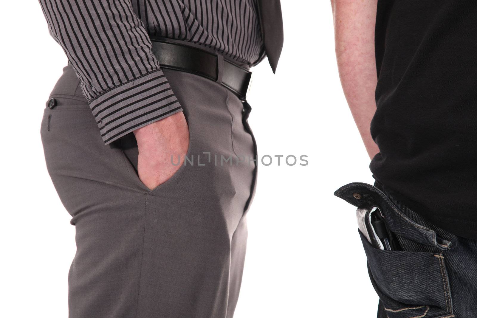 Cropped view image of a smartly dressed pickpocket sizing up his victim standing just behind him eyeing his wallet protruding from his rear pocket