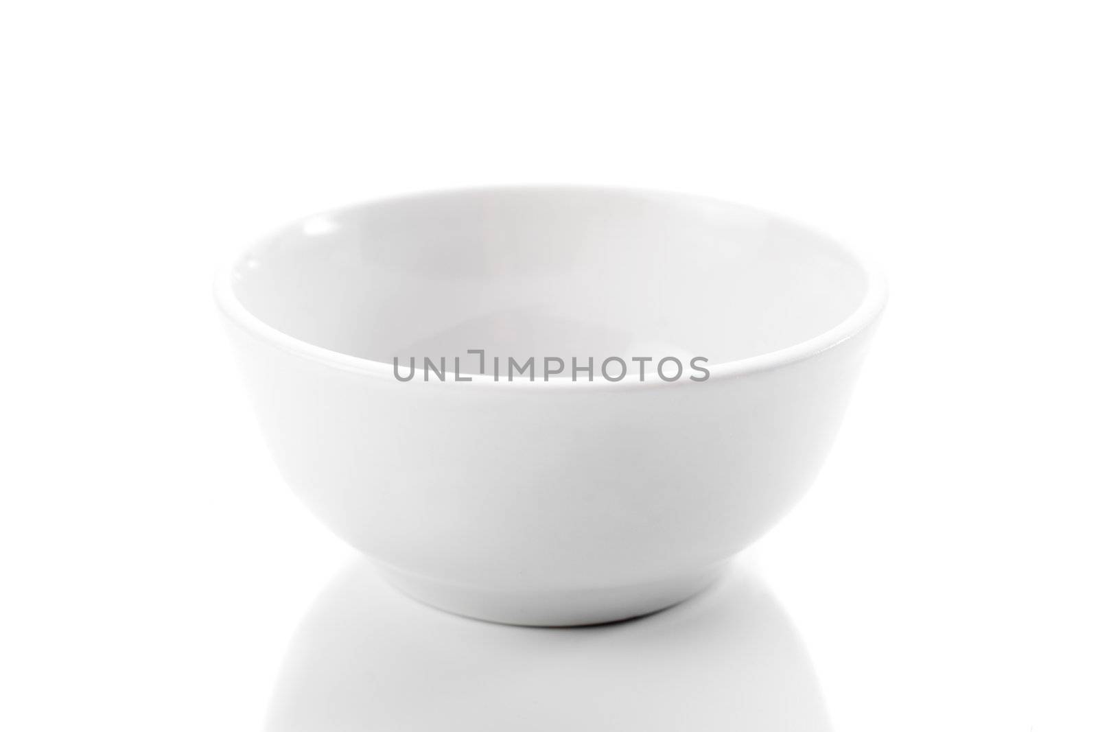 brand new white dish on bright background