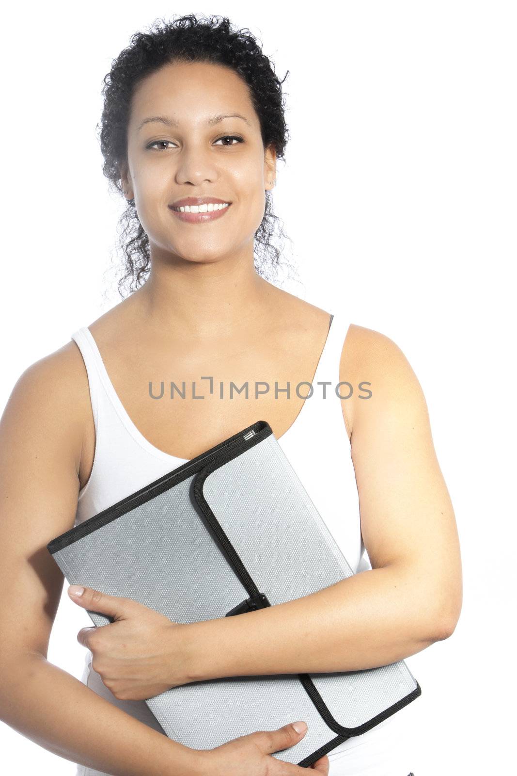 Beautiful young female African American graduate student or business woman holding a stylish folder in her arms as she smiles at the camera isolated on white