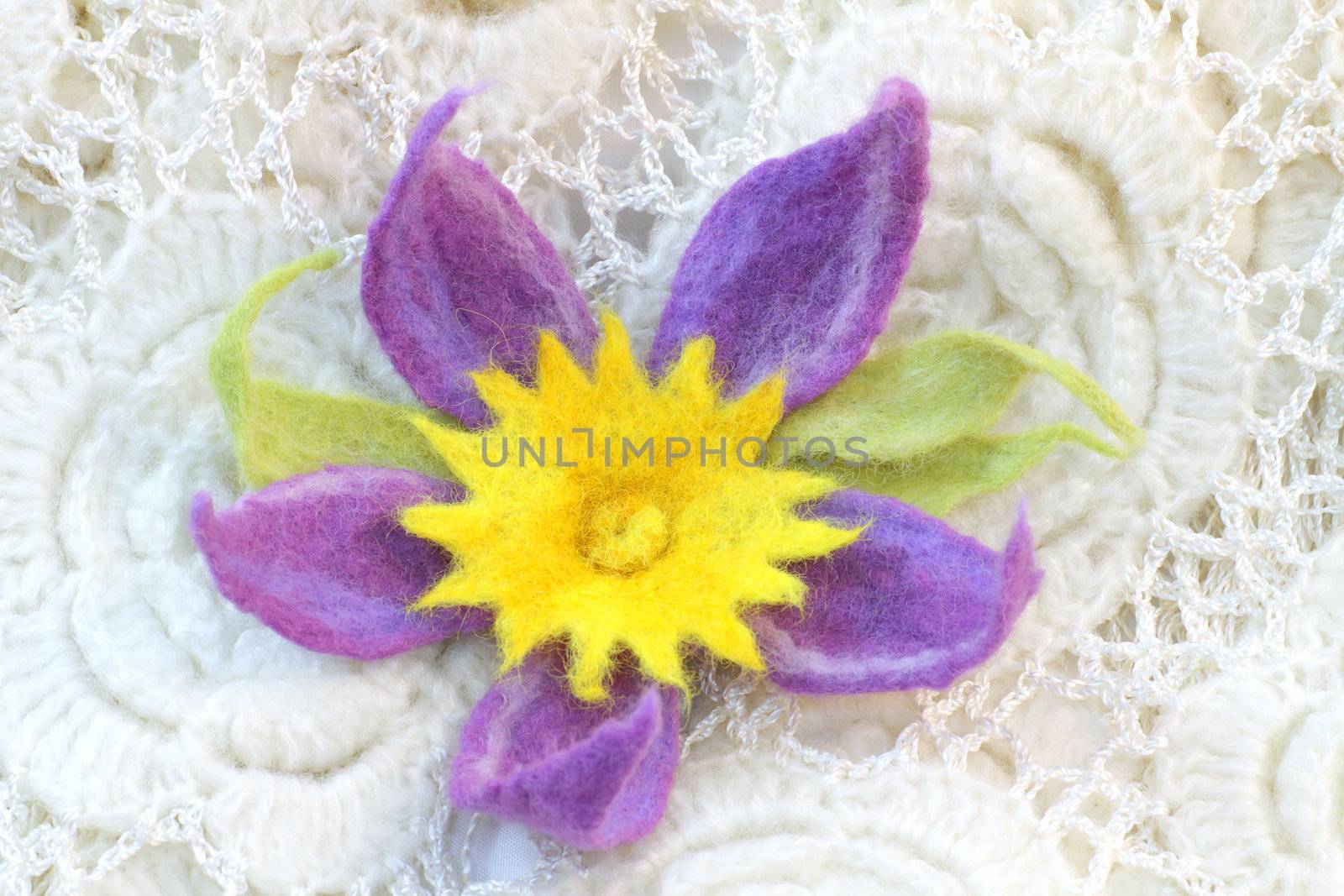 violet flower made of felt, hairpin, brooch, on the white shawl