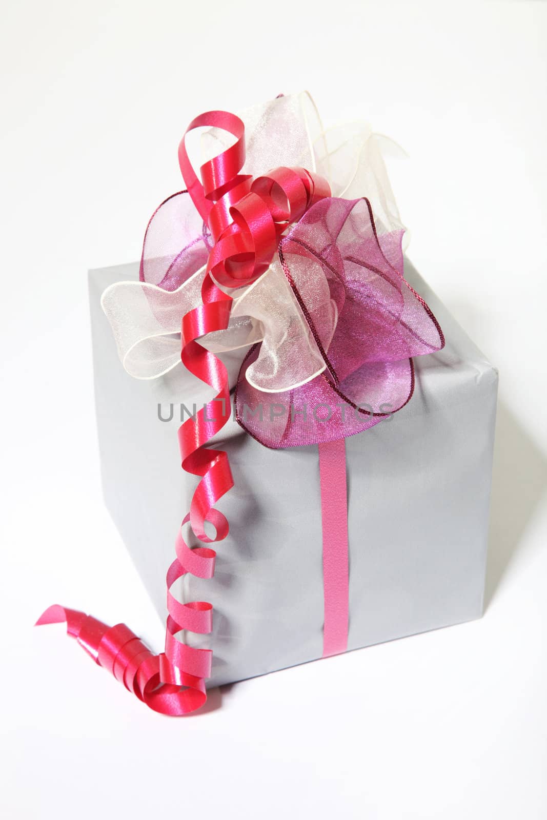 A beautiful gift with bow on white background