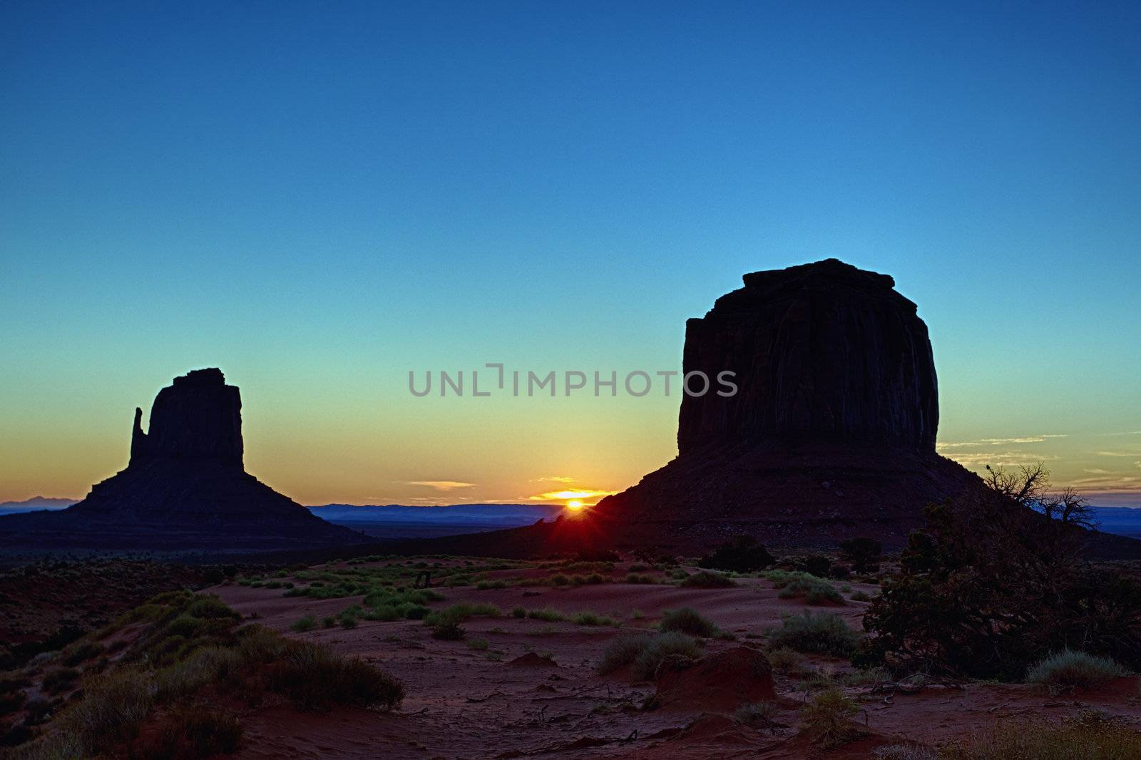 first rays of sun on monument valley, USA