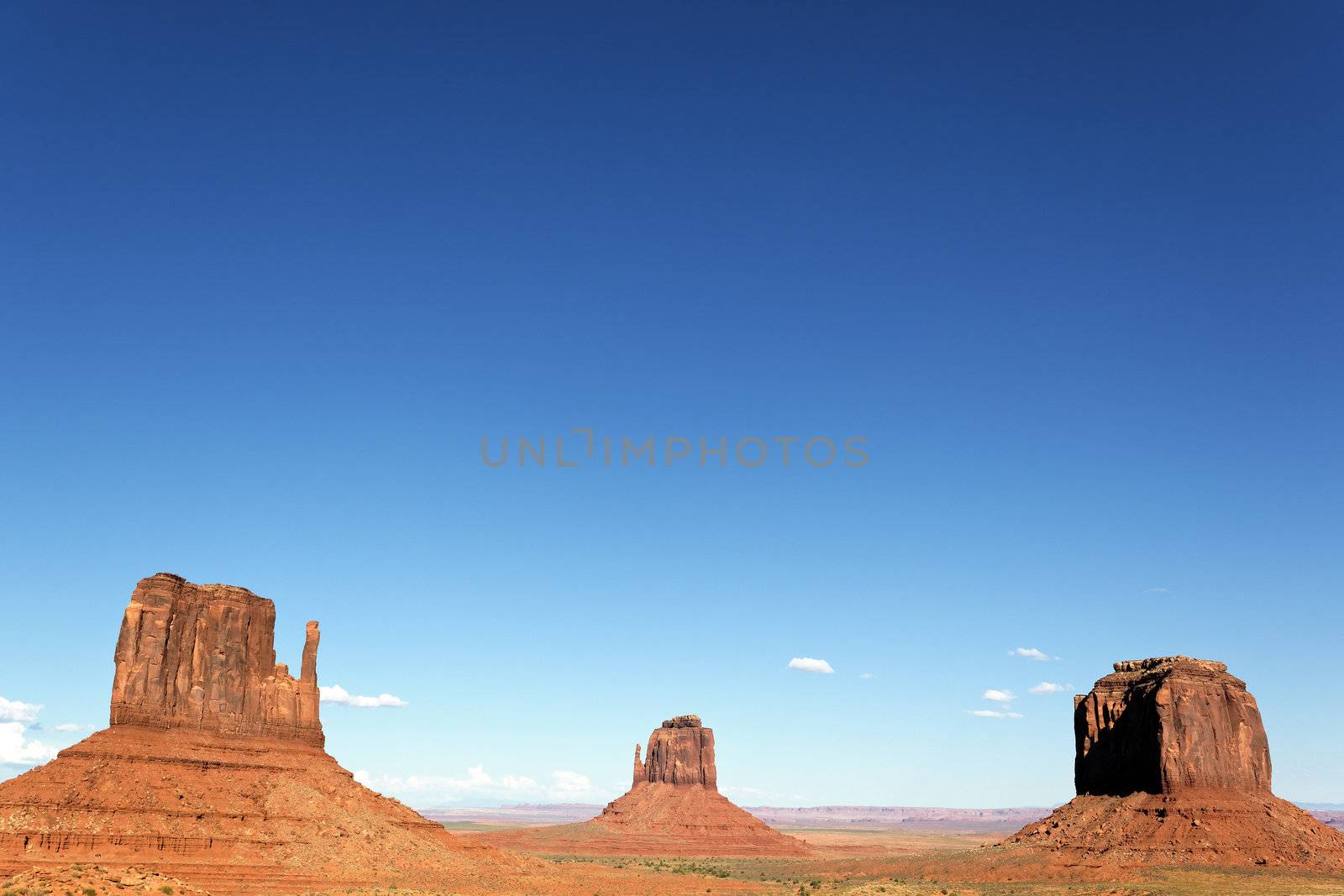 famous view of Monument Valley with big blue sky, Utah, USA. 
