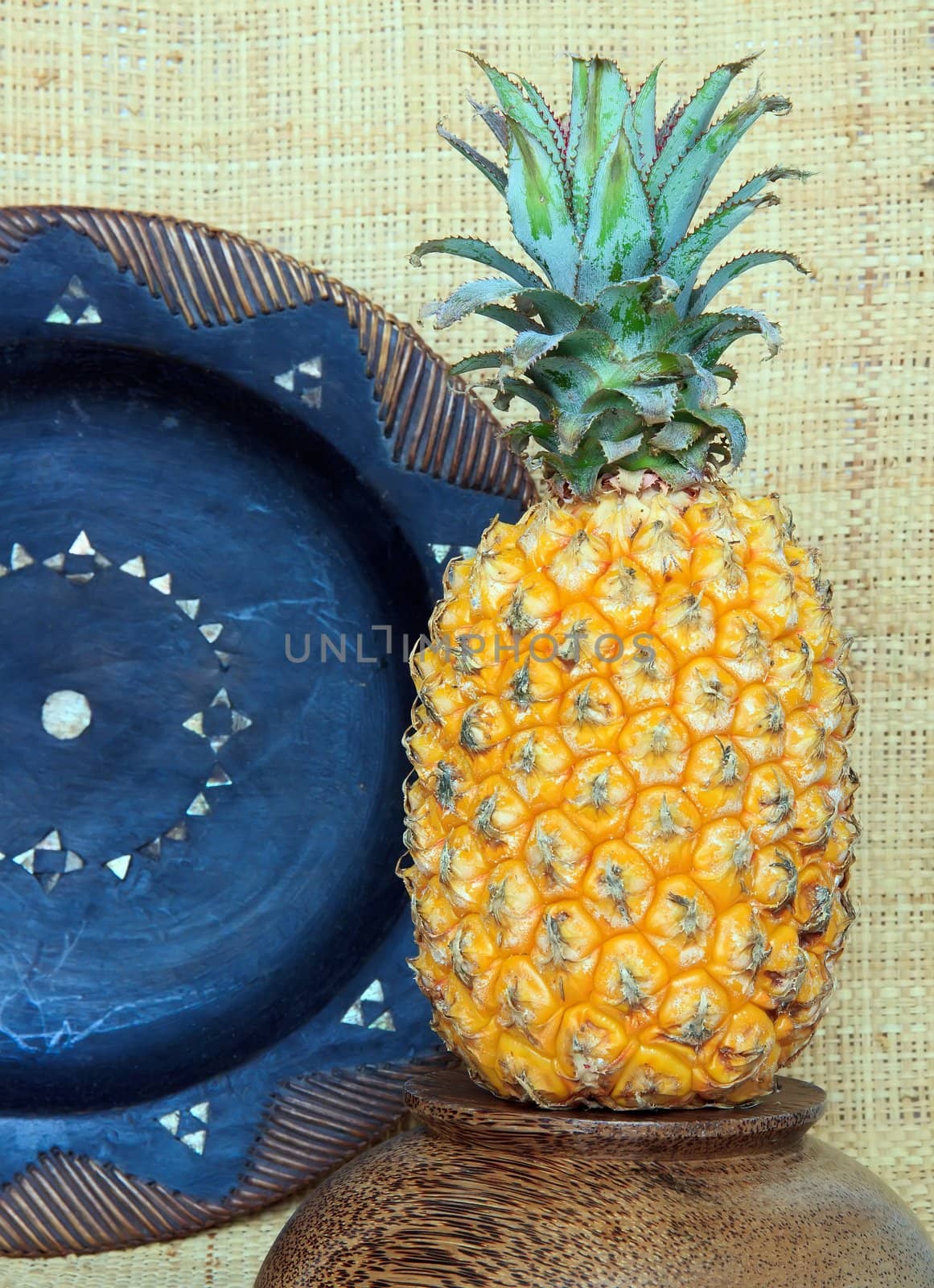 pineapple in a setting of exotic objects