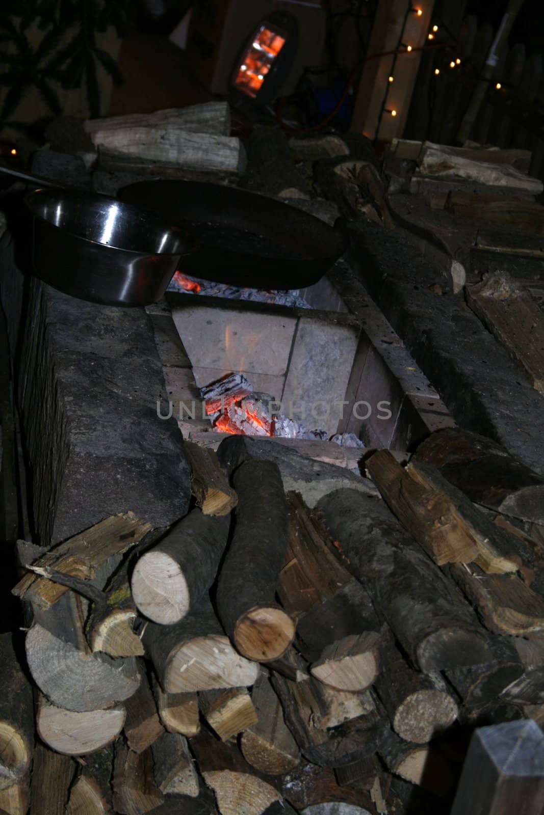 burning fireplace with firewood in the night