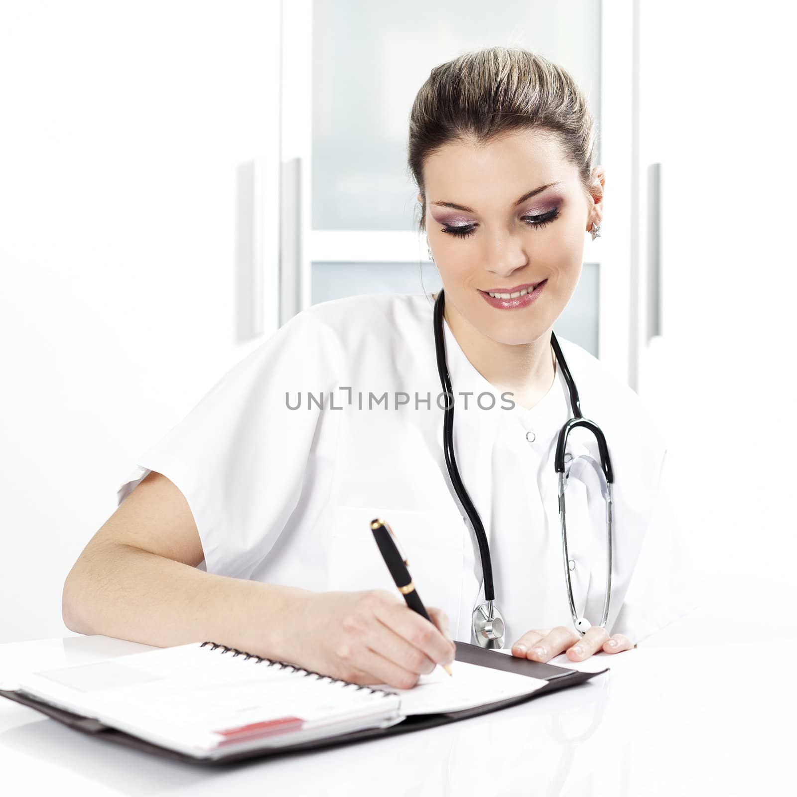 doctor with pen and stethoscope in hospital