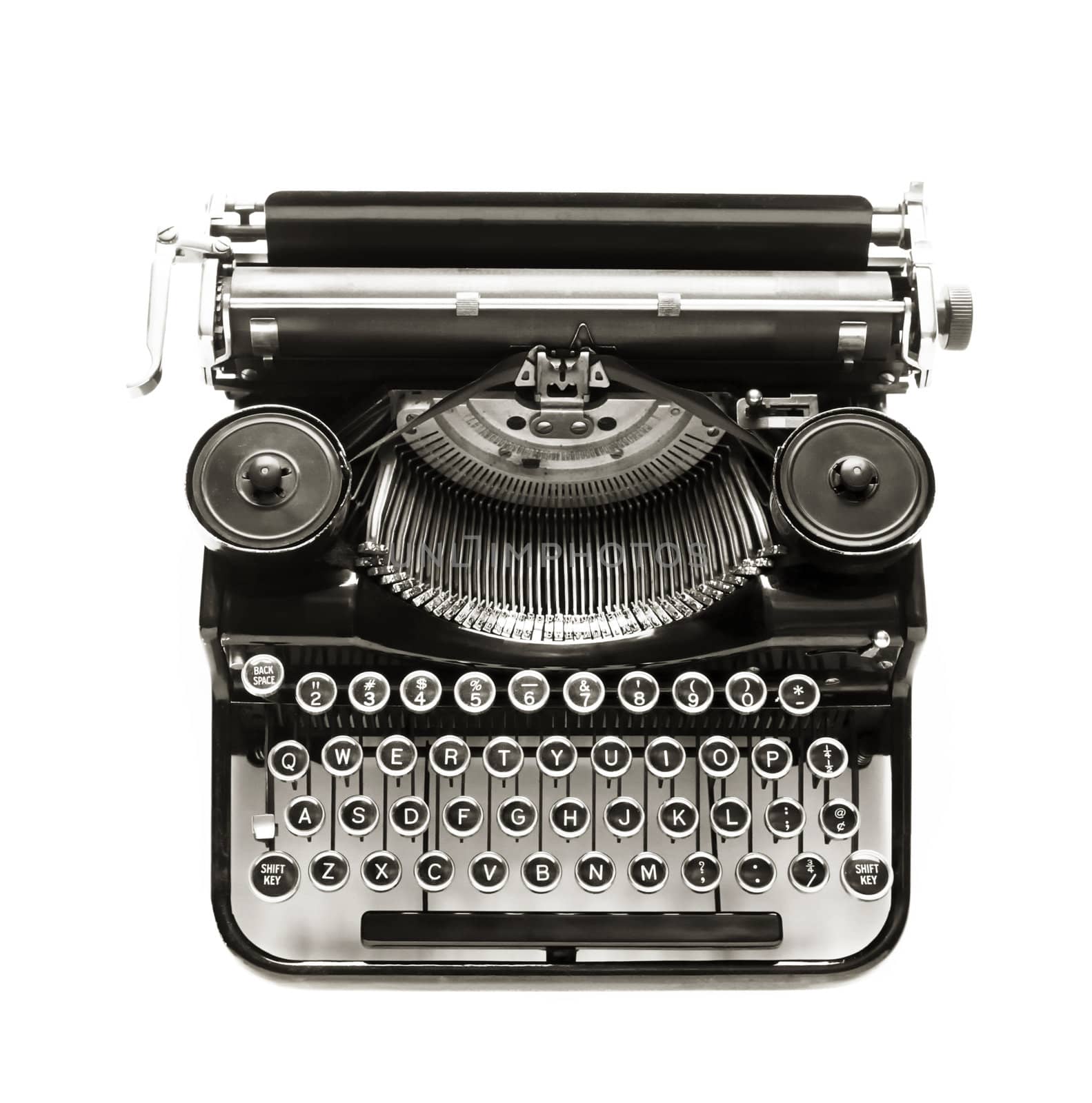 Antique typewriter against a crisp white backdrop.
