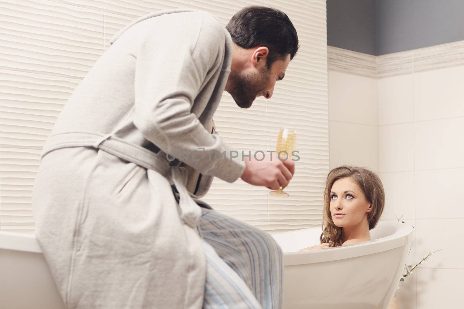 Young beautiful couple in the bathroom by robert_przybysz