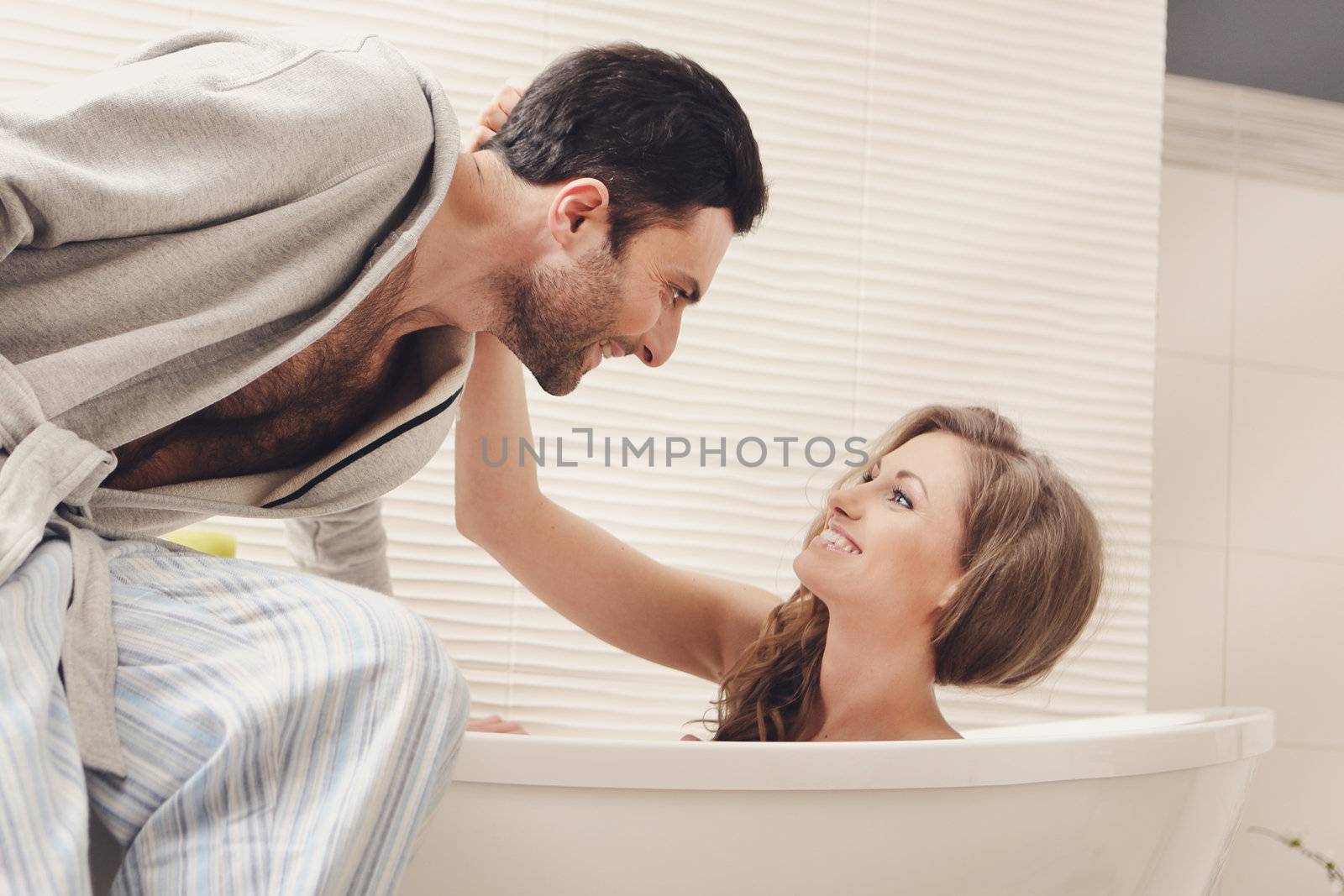 Young beautiful couple in the bathroom