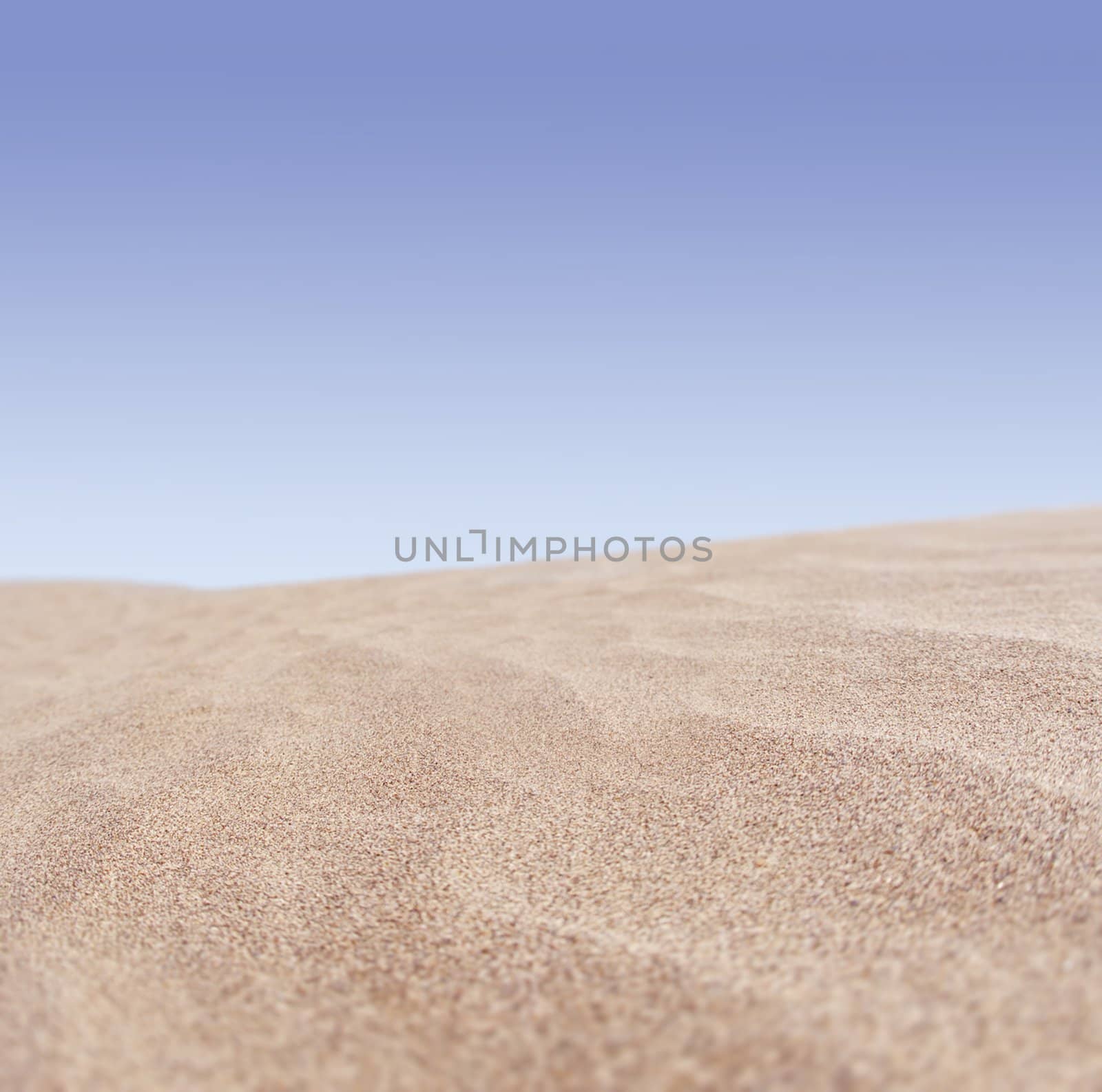 Sand and sky with clouds