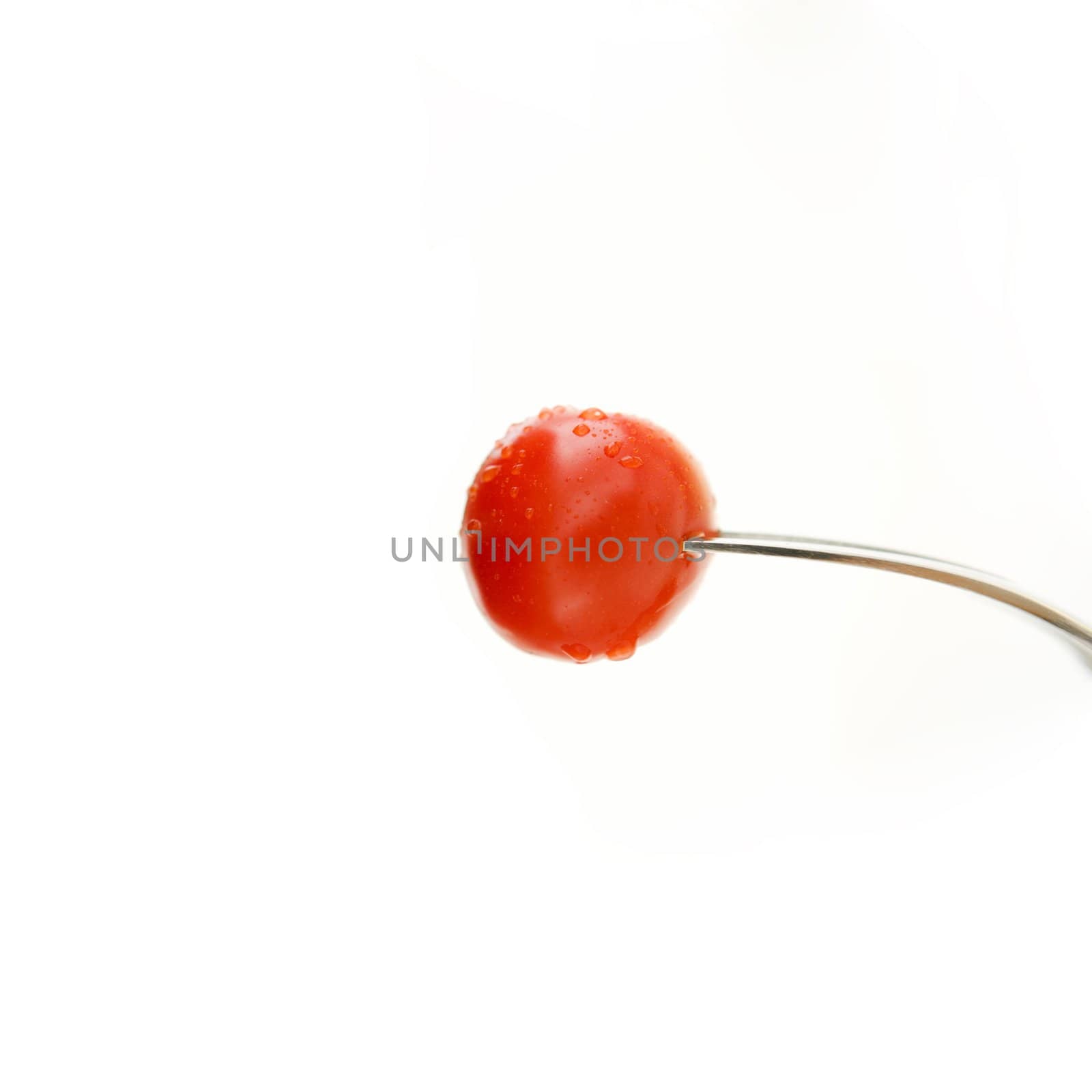 Tomato cherry on a fork