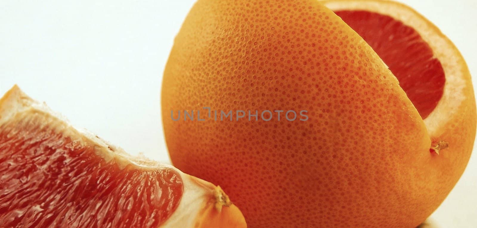 orange slices on a white by ozaiachin
