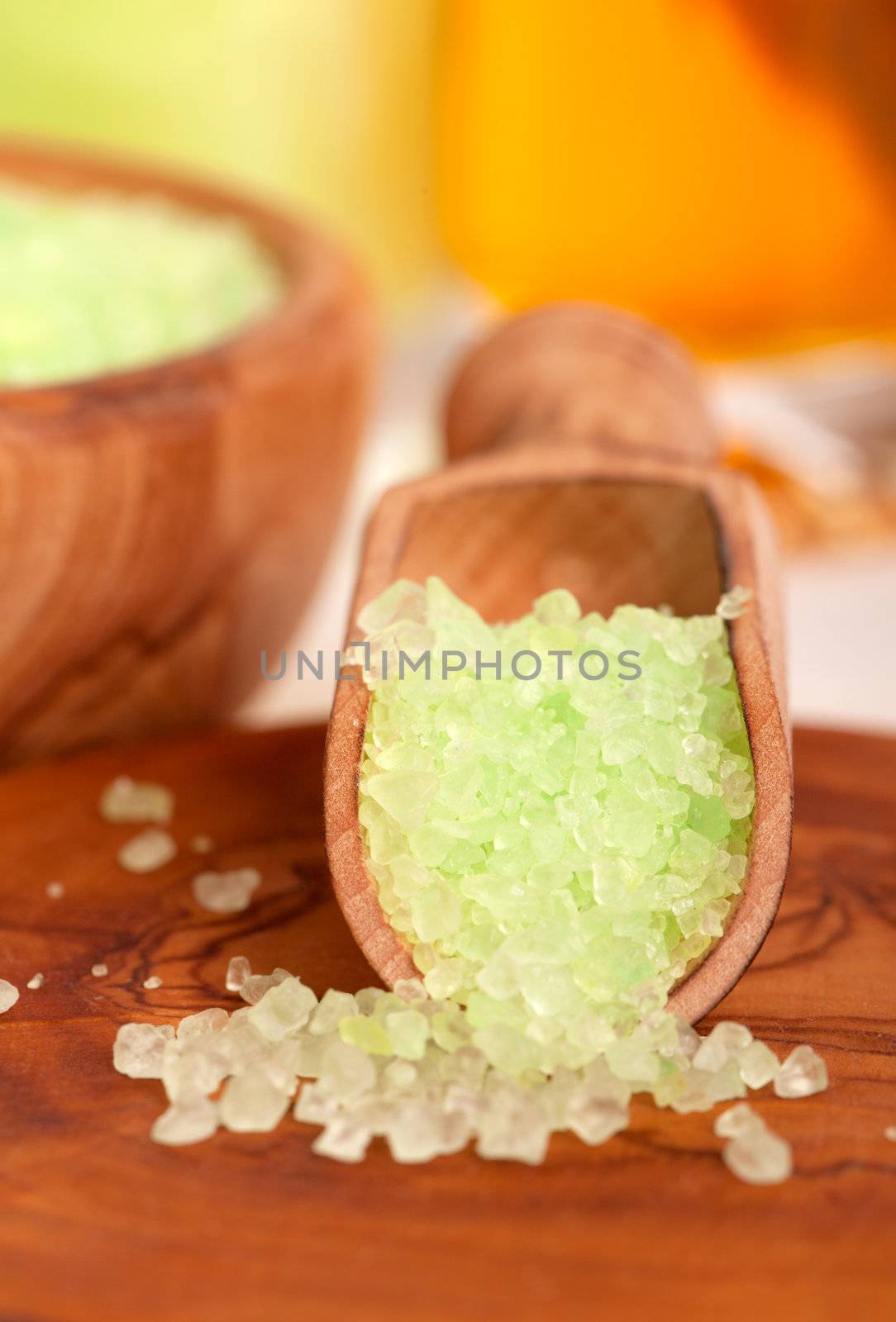green herbal salt in the wooden spoon.