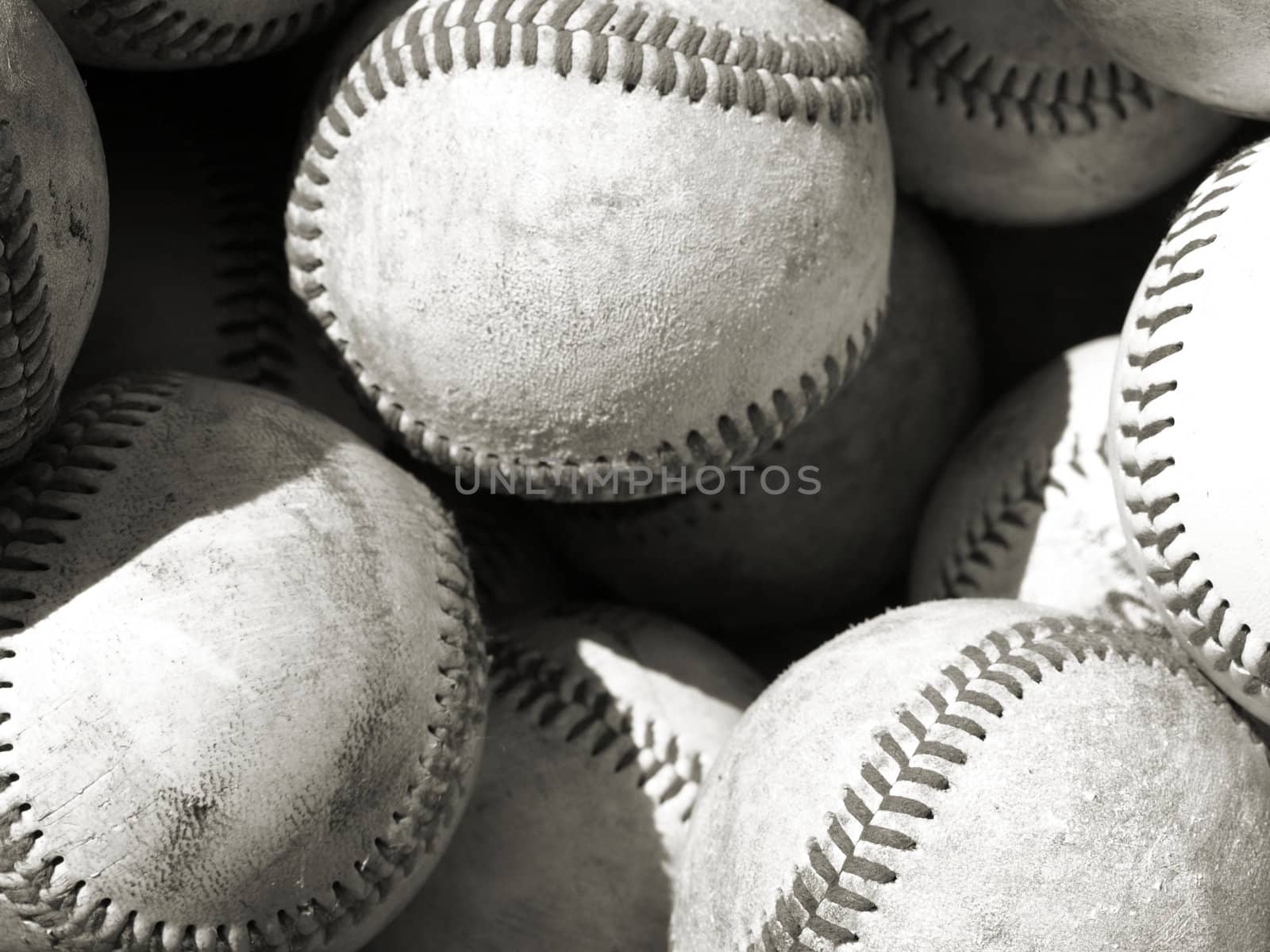 bucket of old baseballs ready for practice