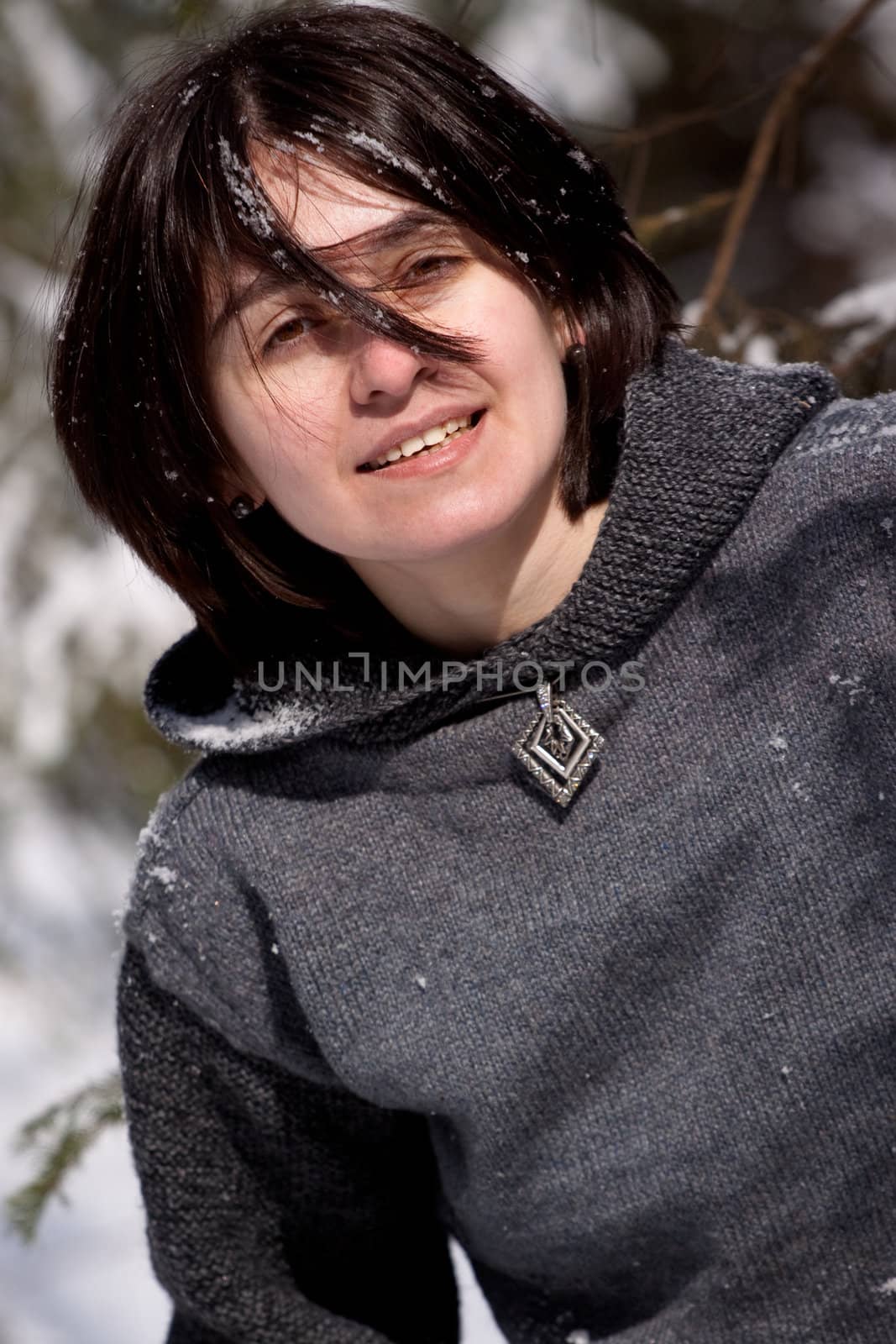 Girl in gray dress and snow
