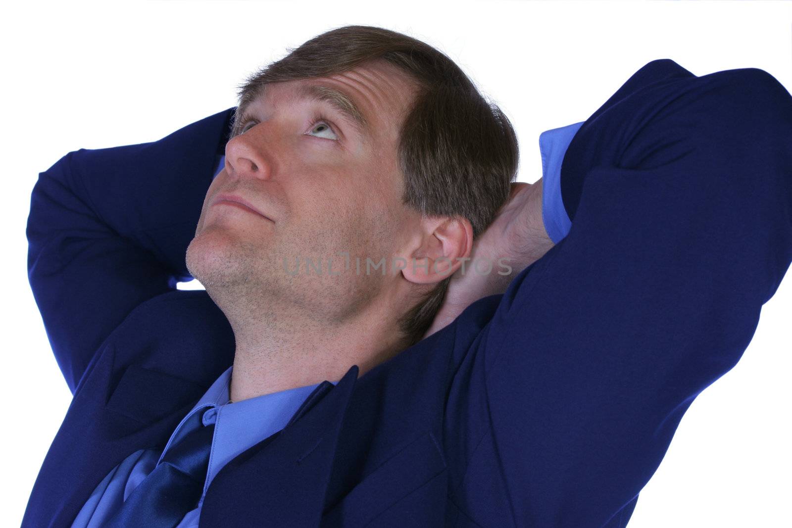 Handsome businessman relaxing in his chair, thinking