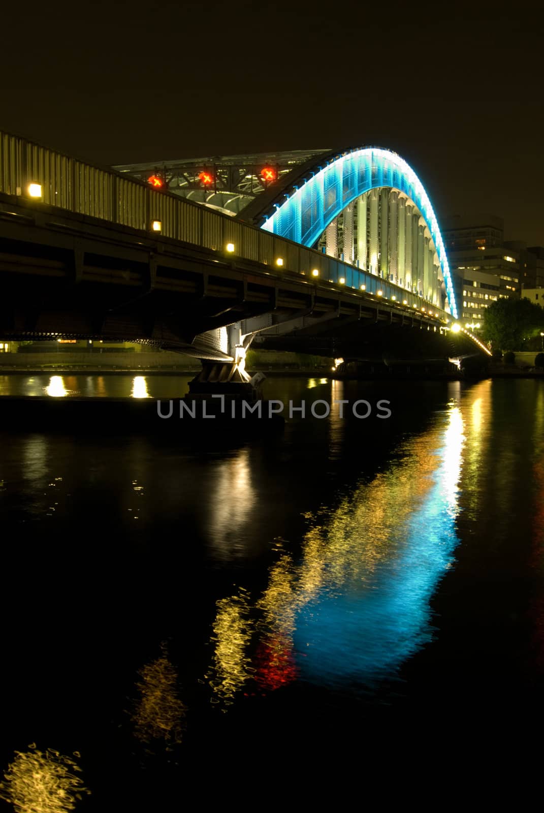 night iron-bridge and reflection in river