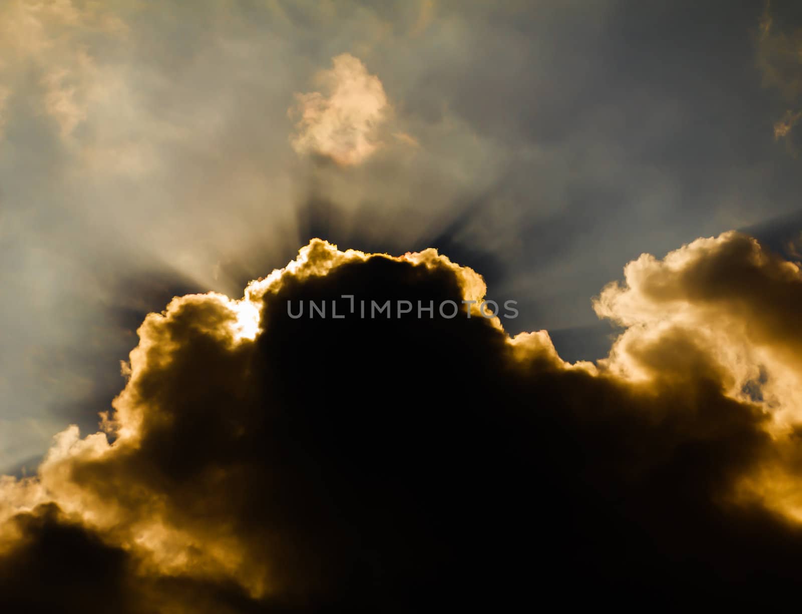 Image of sun shine through rain cloud