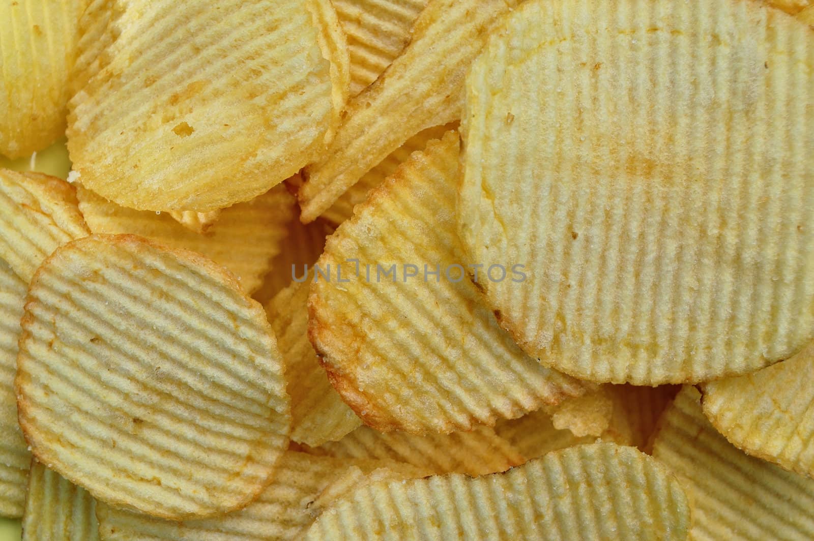Potato chips food texture. Salty snack background.