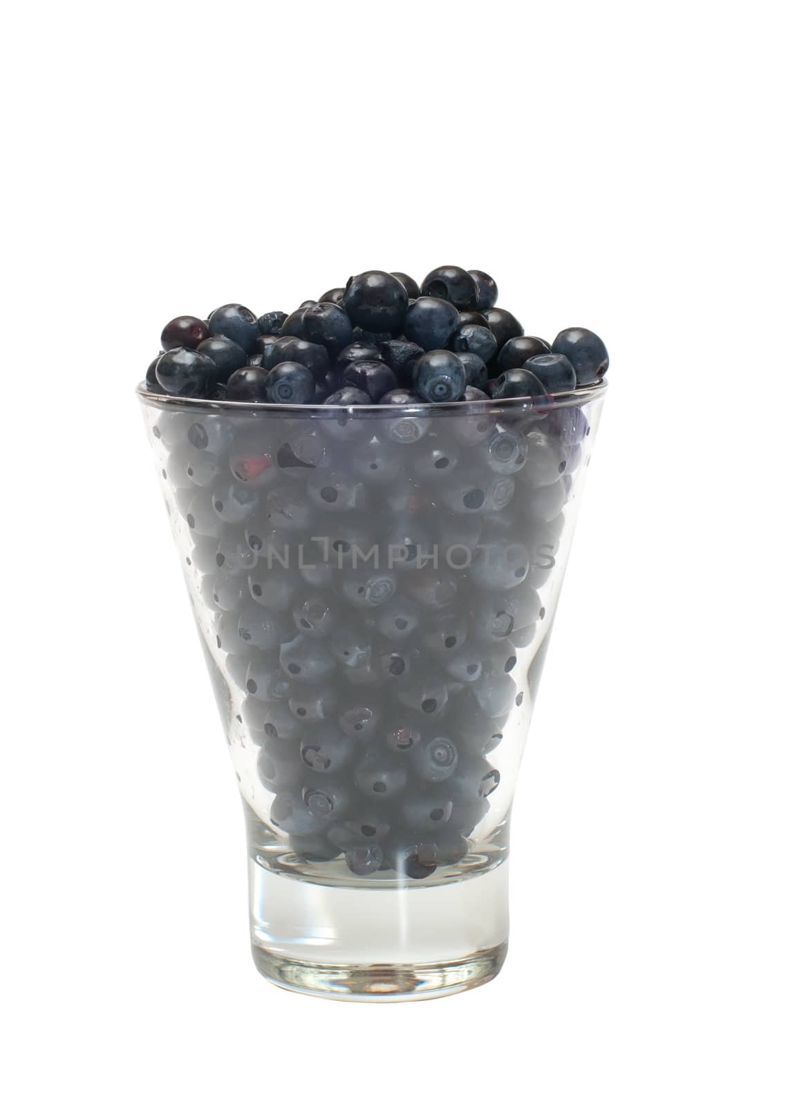 Glass filled by a bilberry it is isolated on a white background.