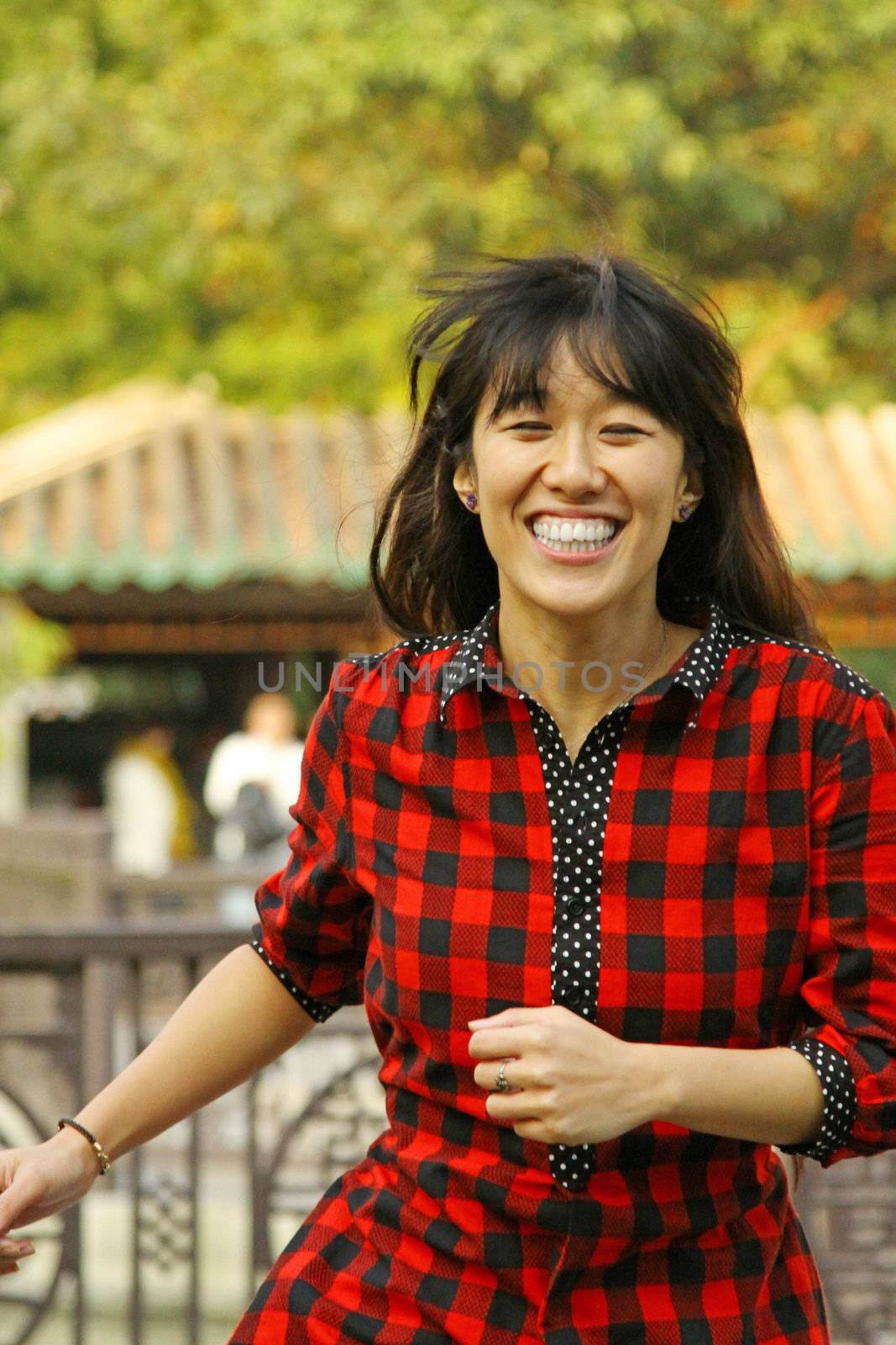 Asian woman running with smile
