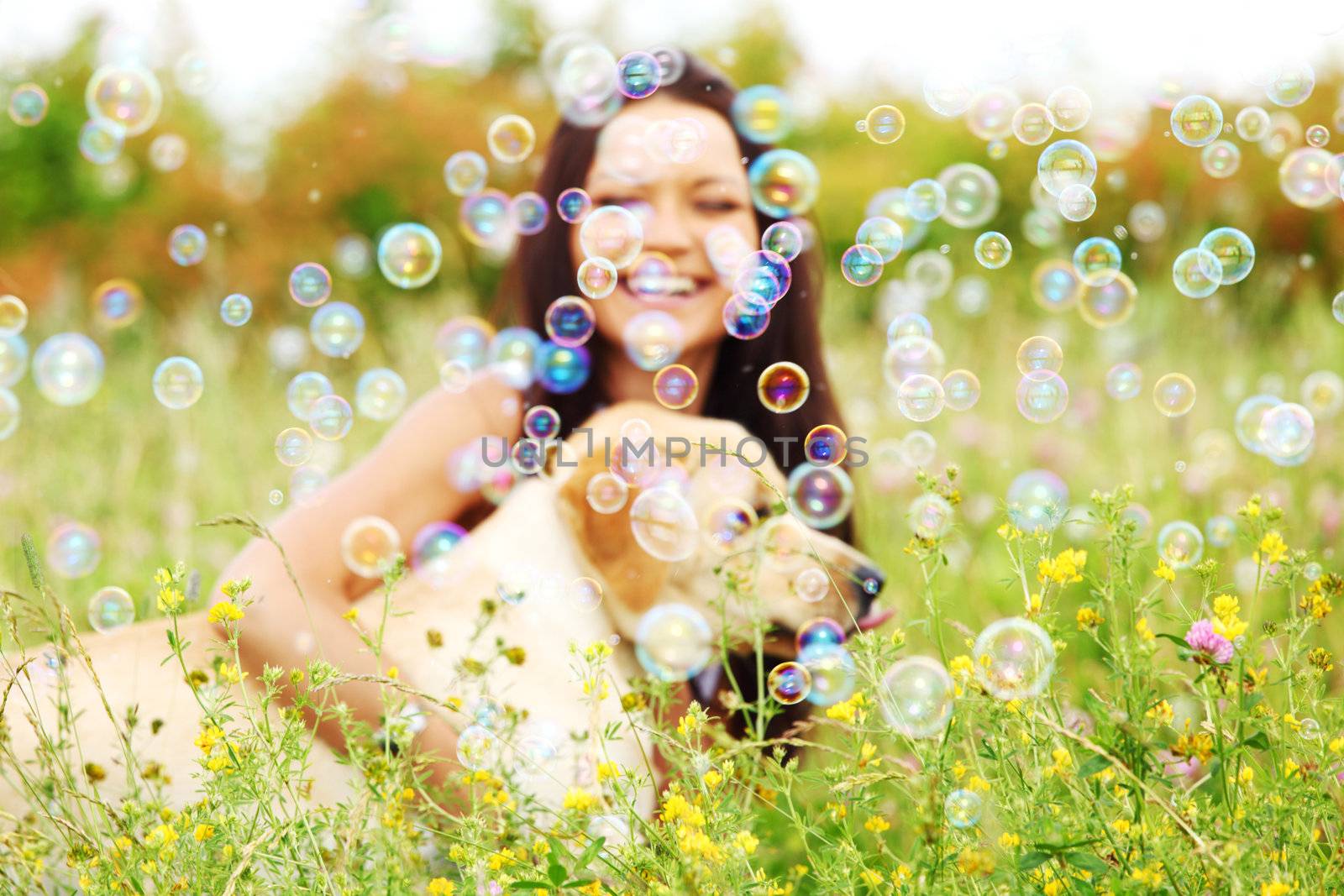 woman and she lablador dog in green grass