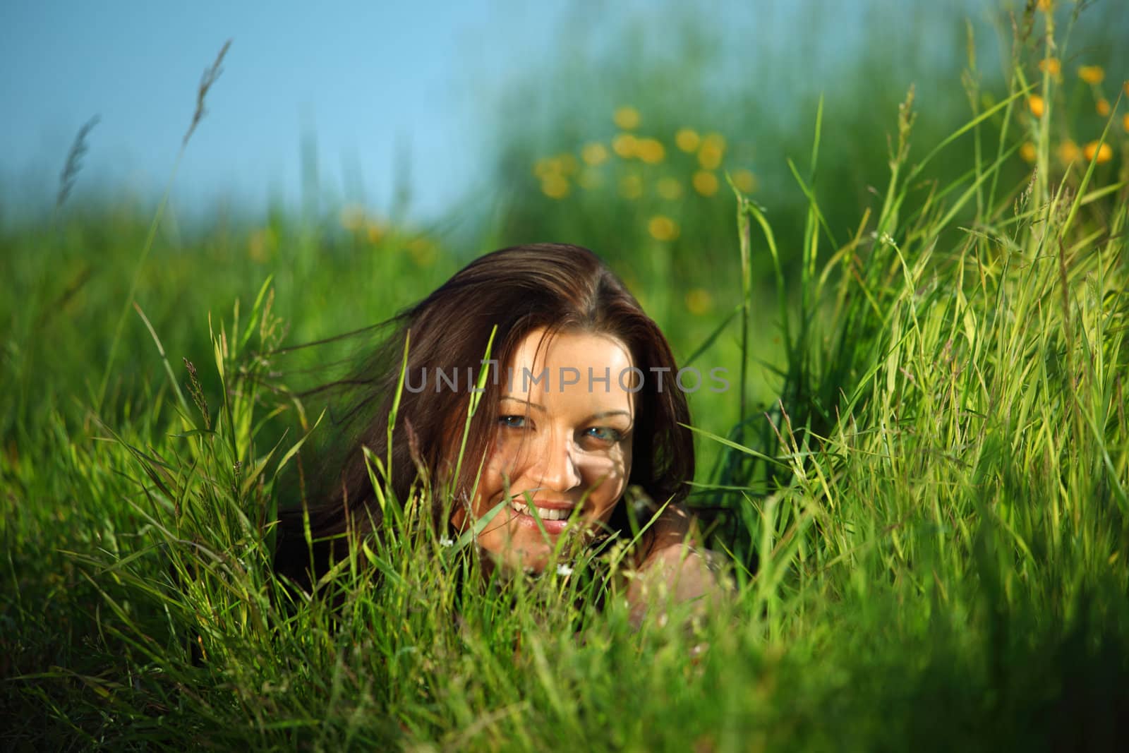  happy woman lay on green grass