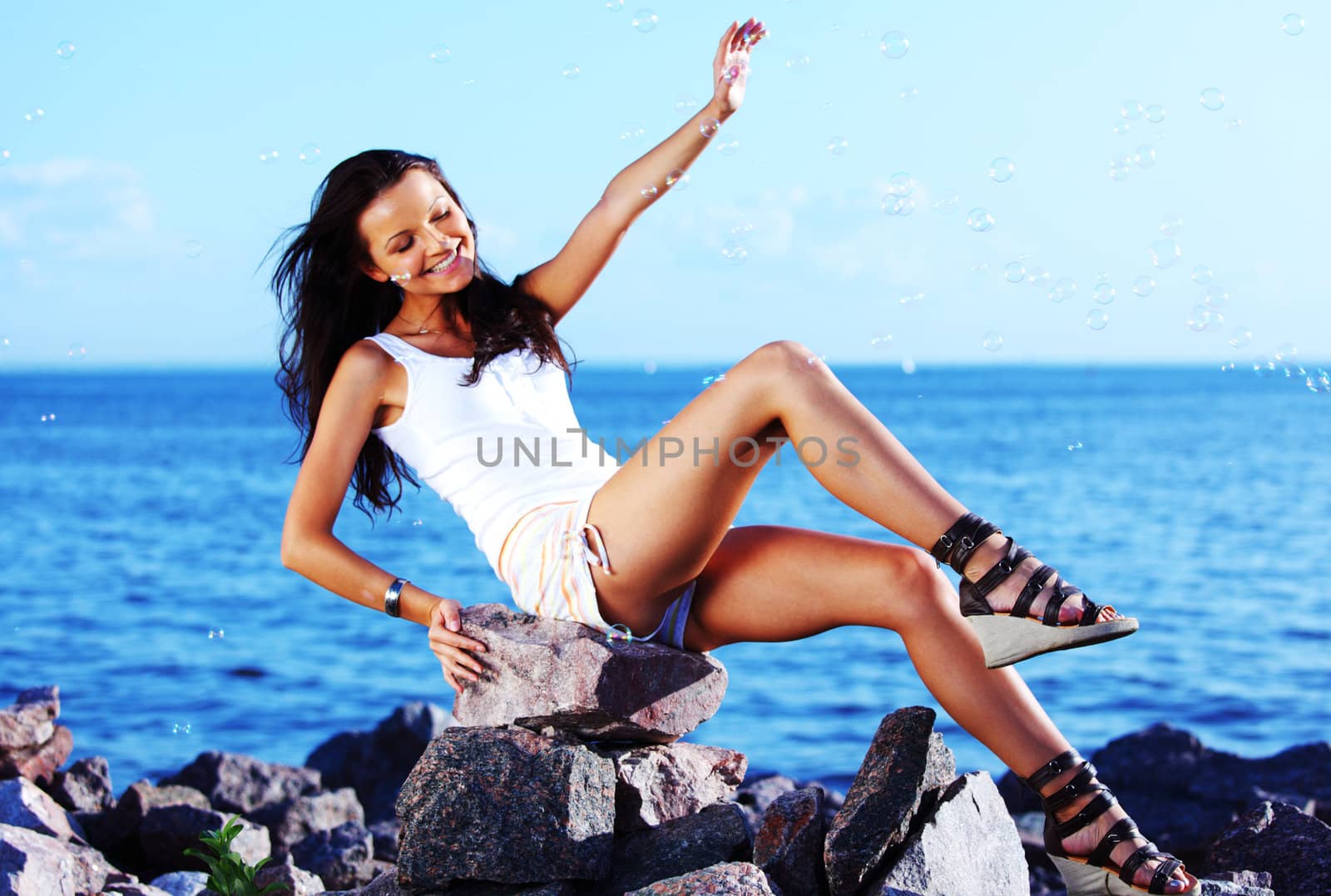  happy brunette hair woman sea on background