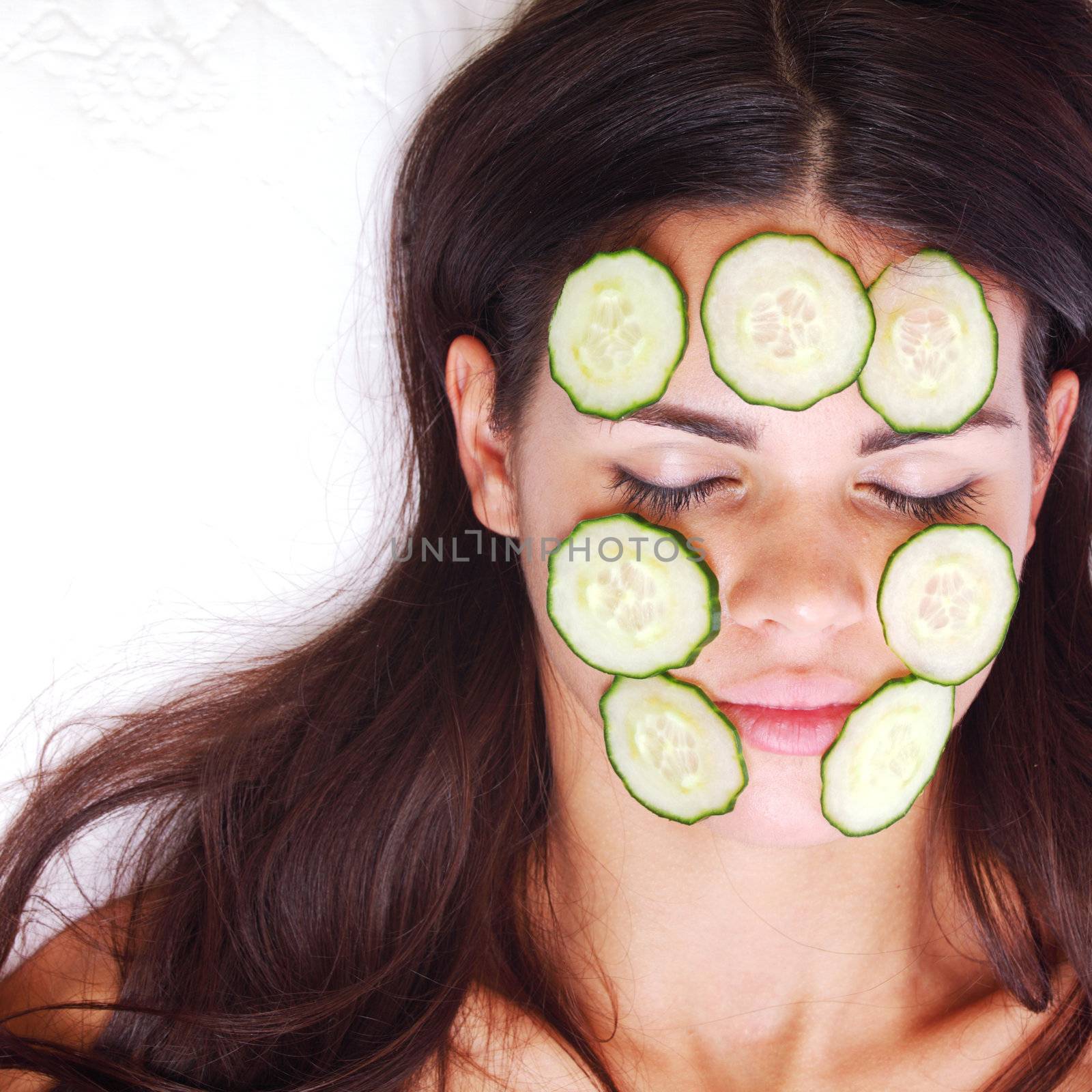 cucumbers circles on a girl face