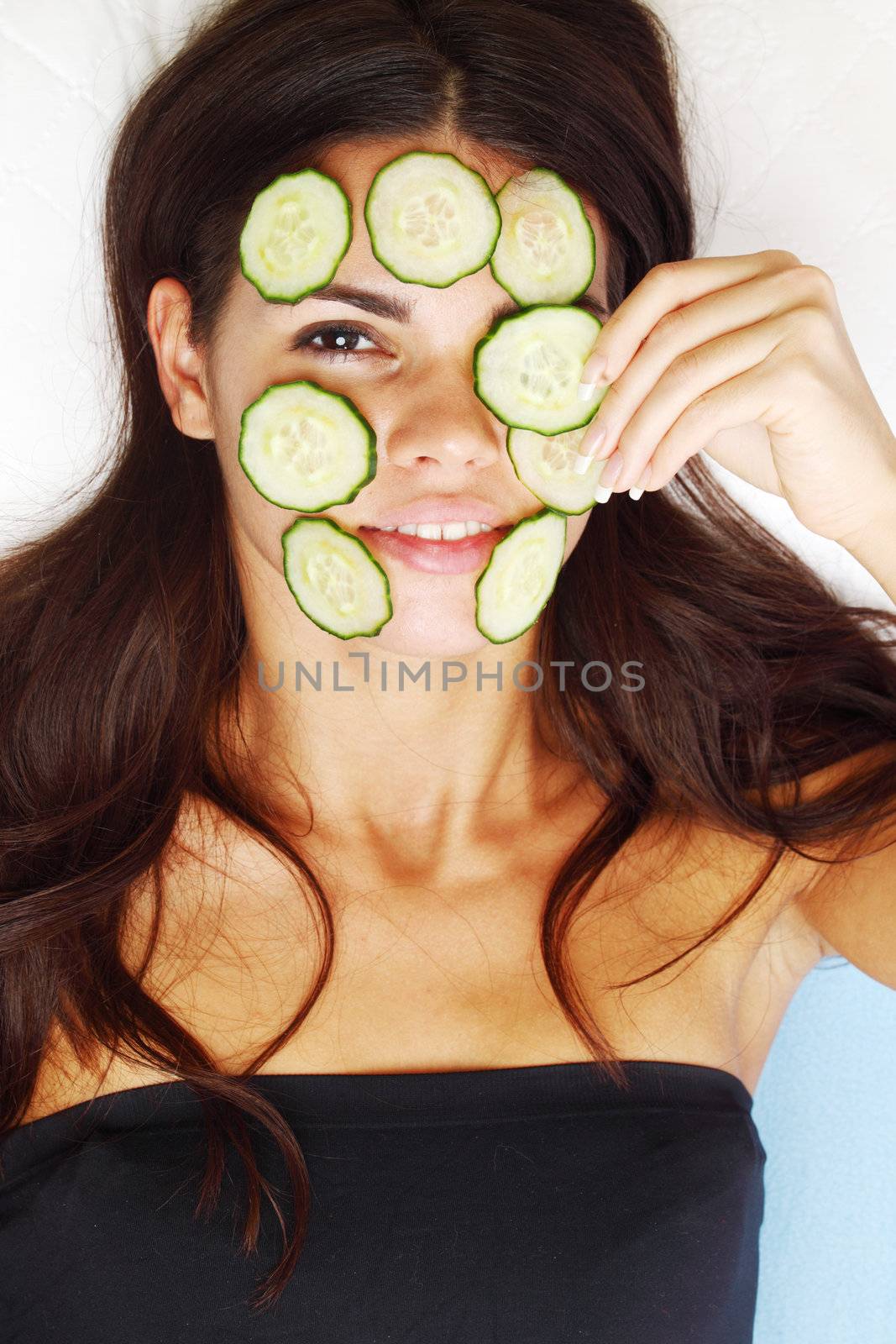 cucumbers circles on a girl face