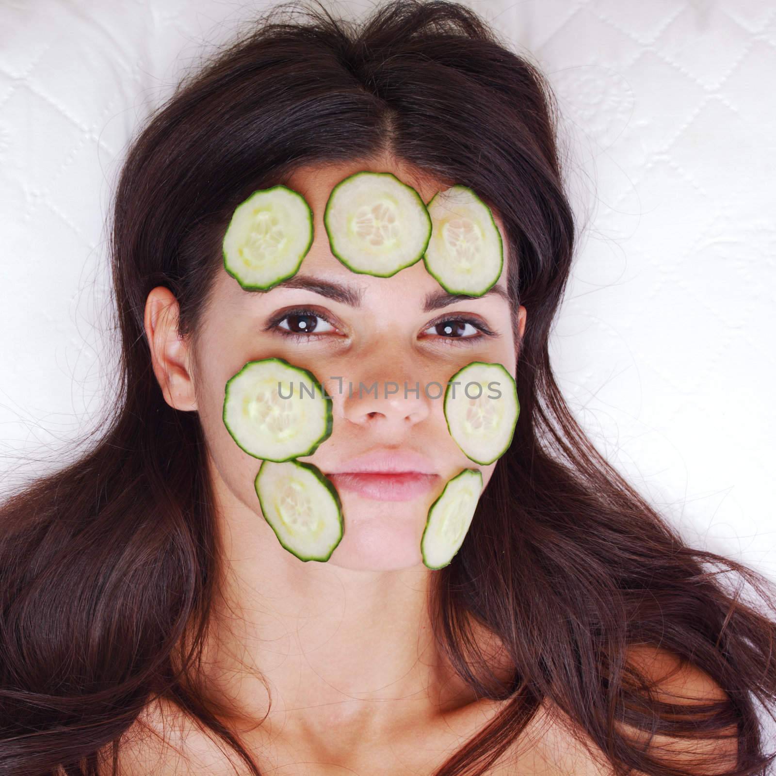 cucumbers circles on a girl face