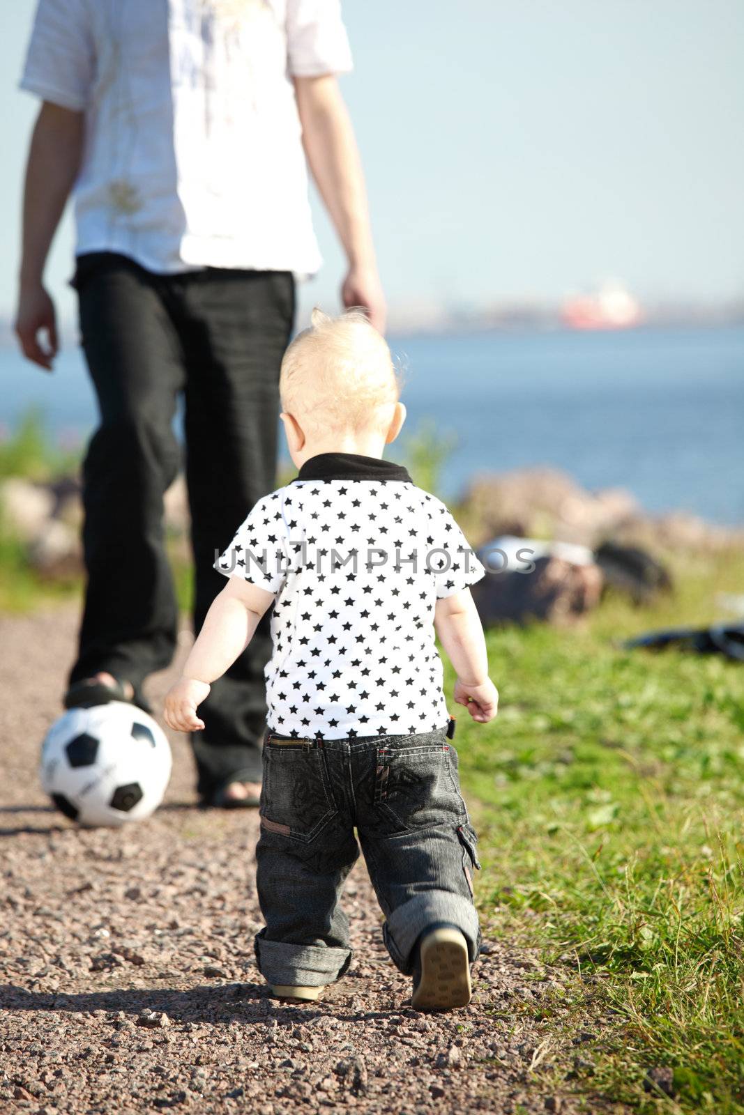 little boy play soccer outdoor