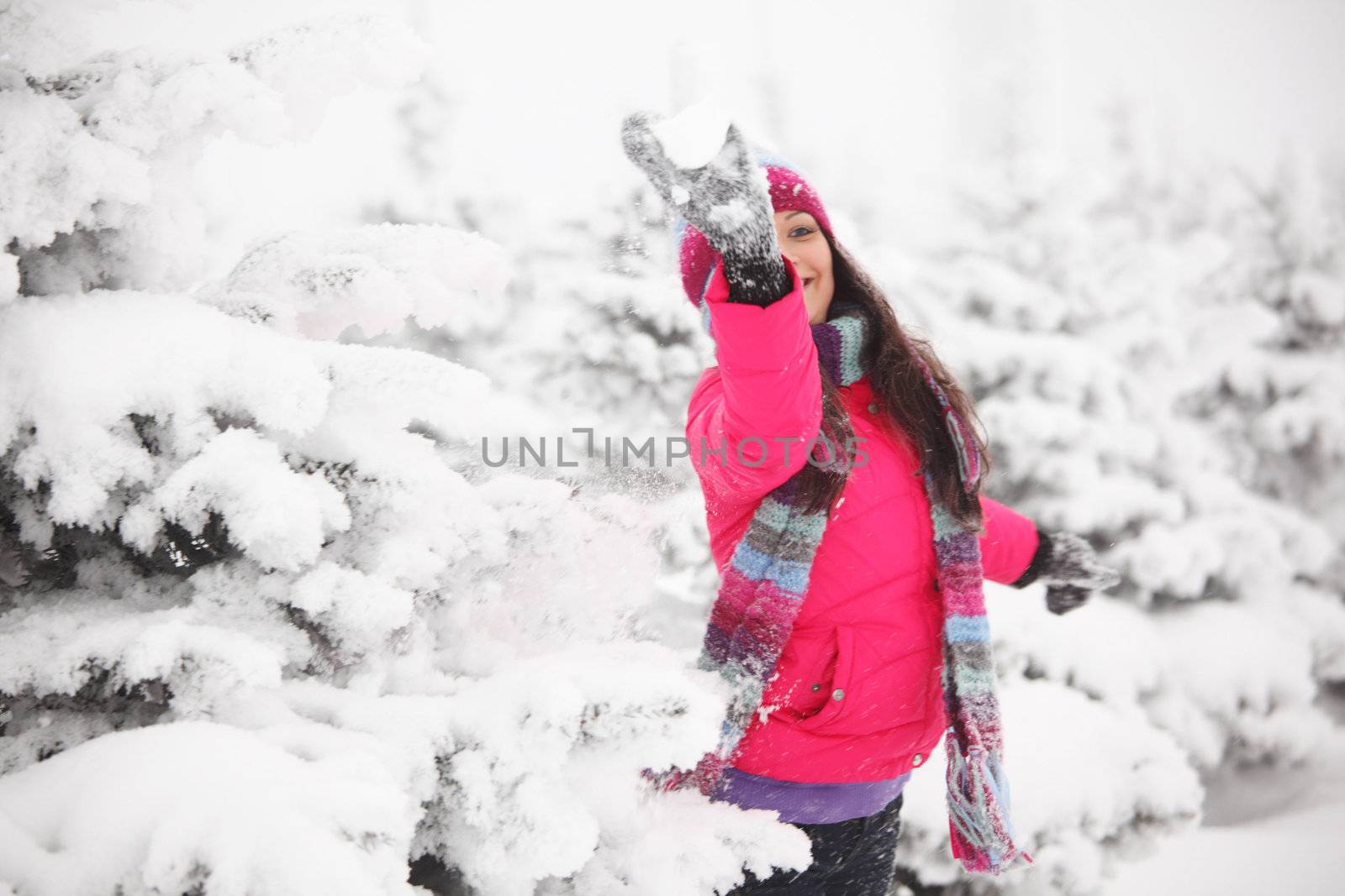 winter girl behind snow tree 