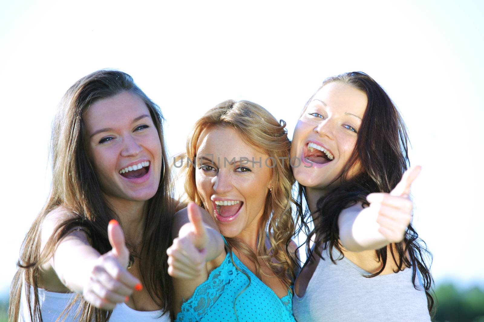 summer girlfriends in sun ligt happy and smile