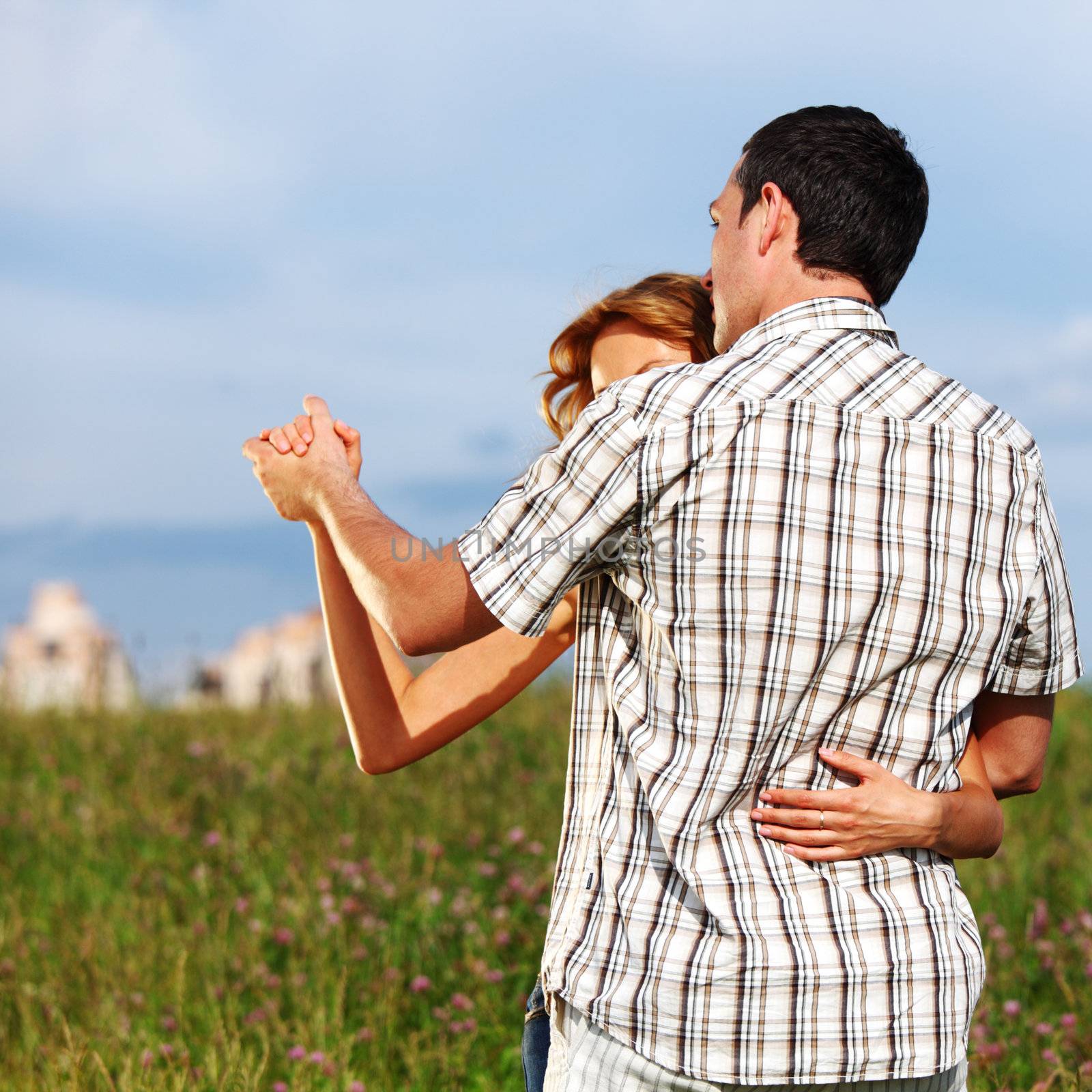 man and woman dance in the sky