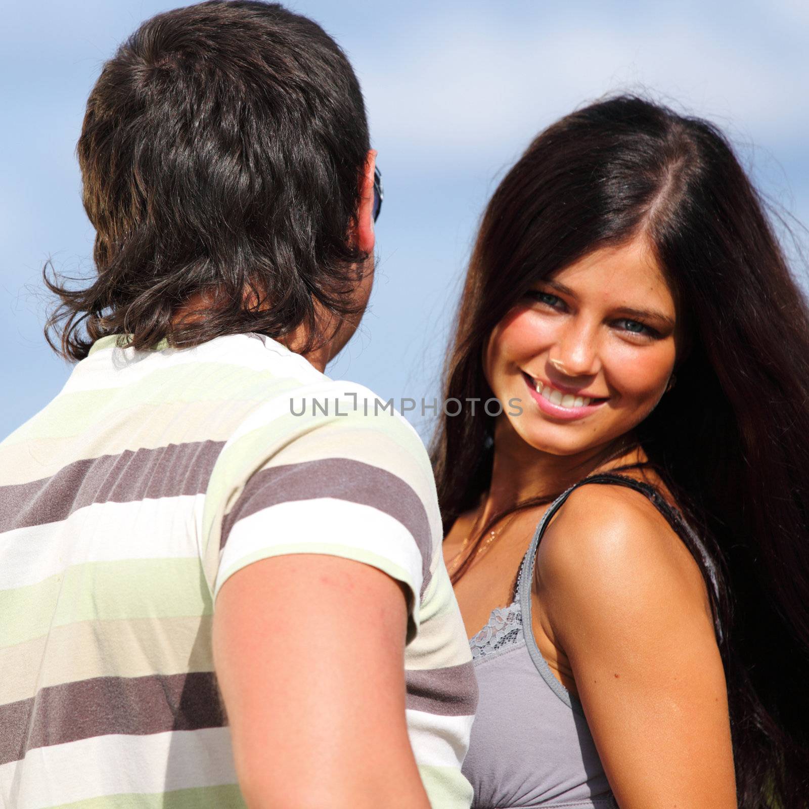 man and woman hug sky on background