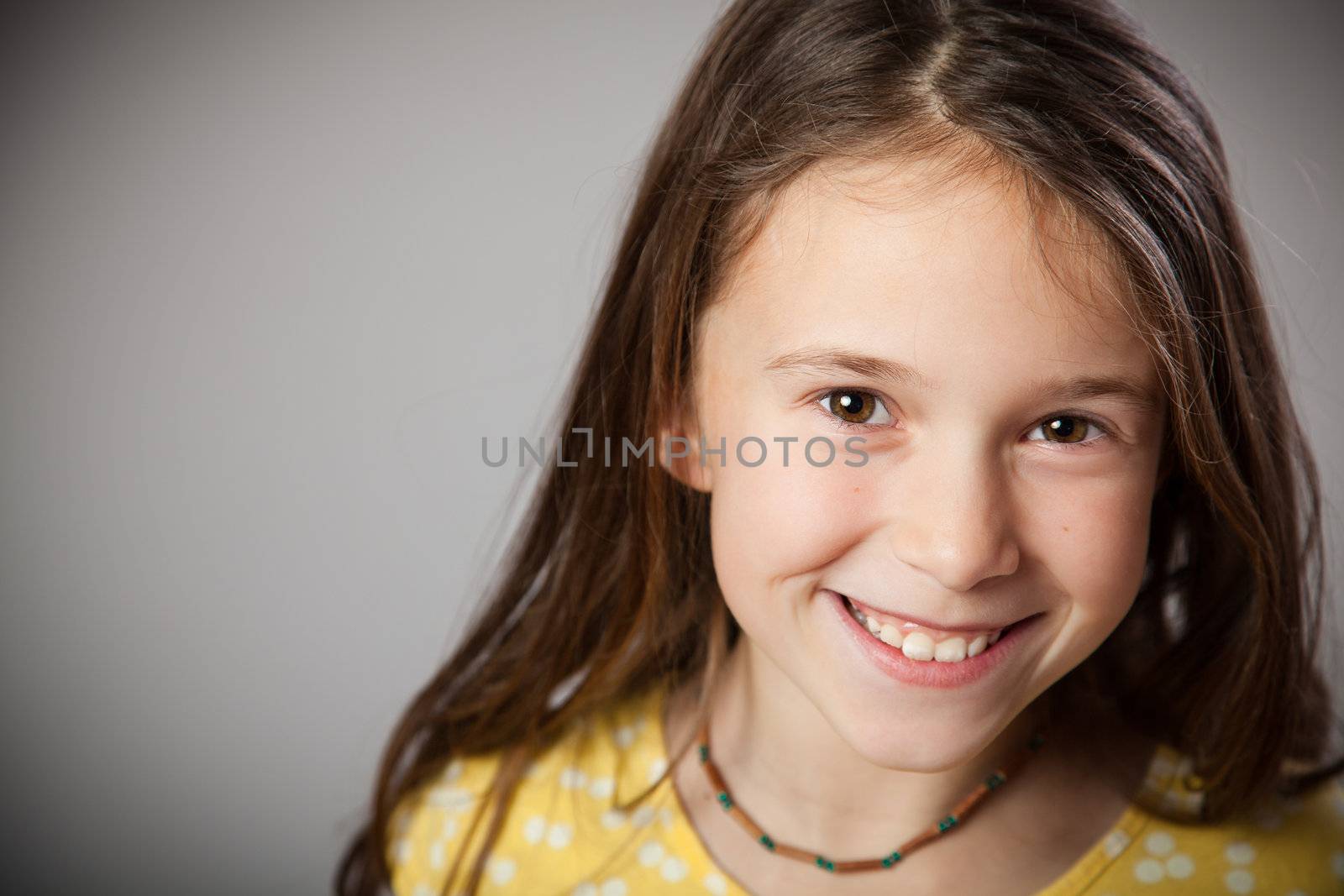 Girl in studio smiling and happy
