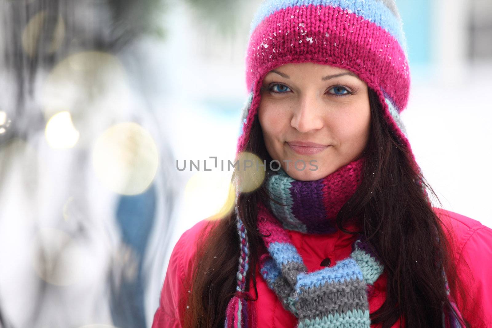 woman in winter hat and holyday bokeh