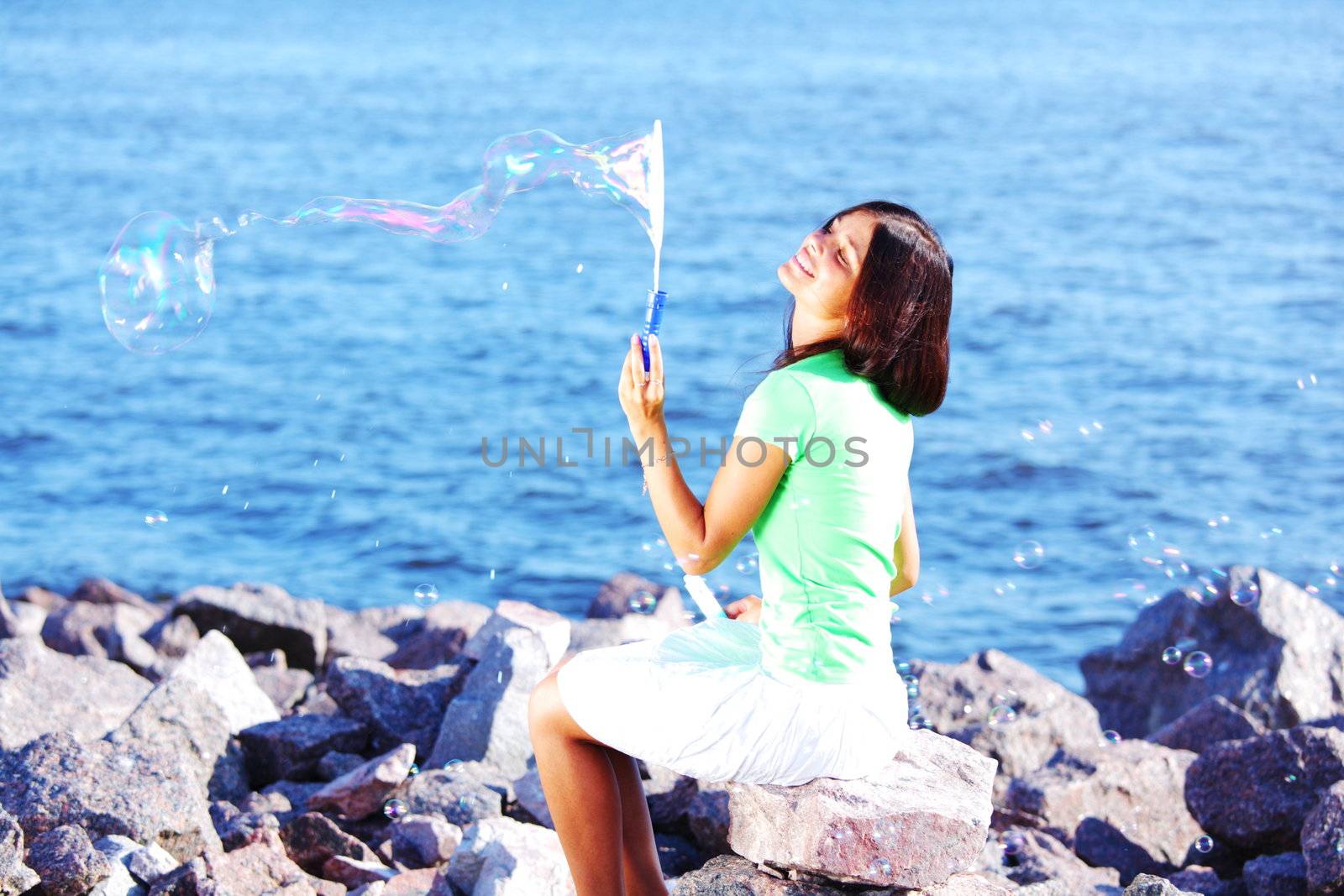 woman relax blue sea and bubbles on background