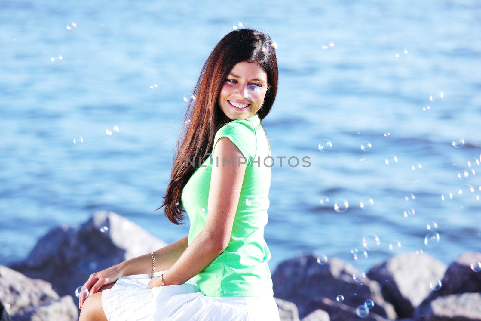 woman relax blue sea and bubbles on background