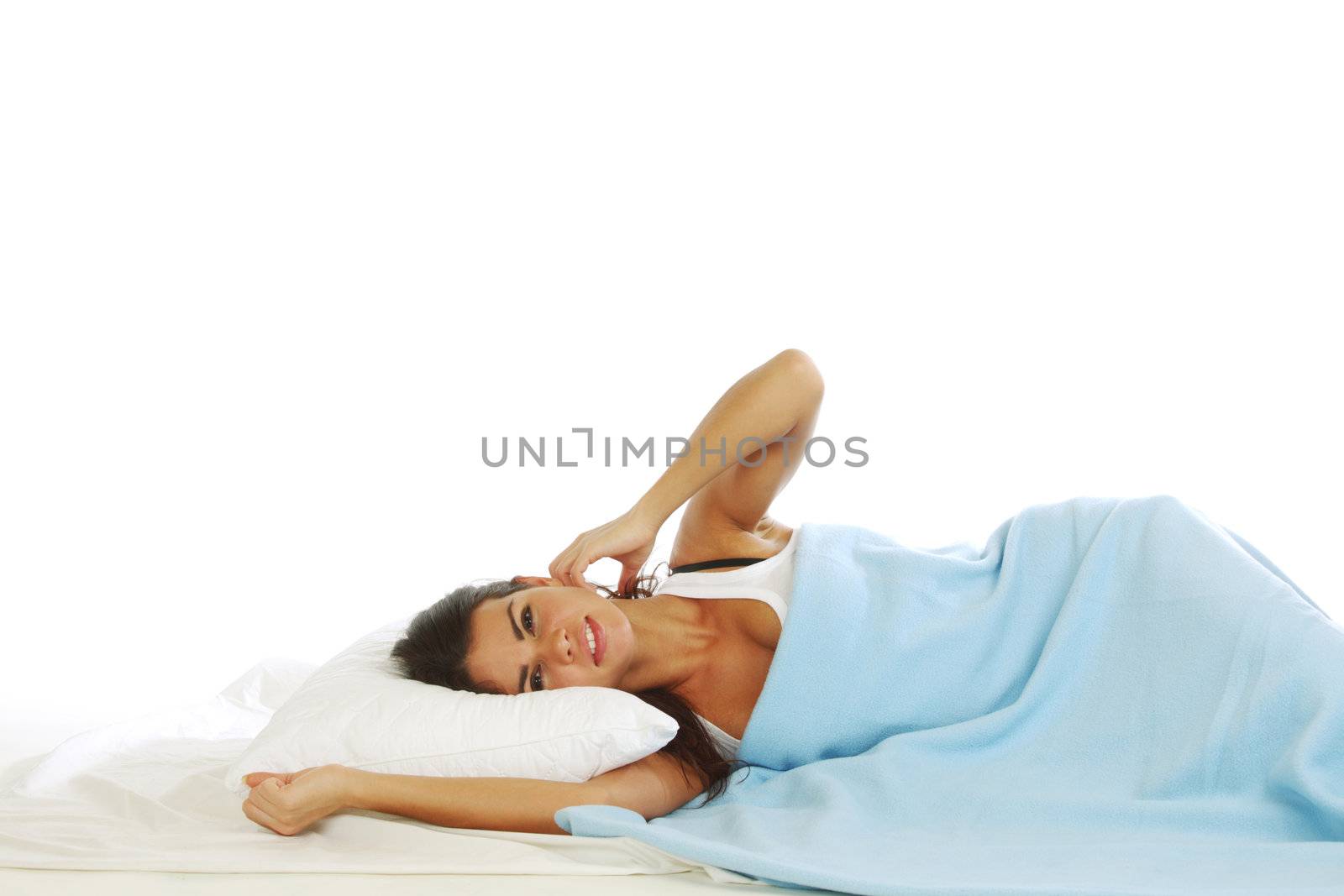 waking woman on the white pillow