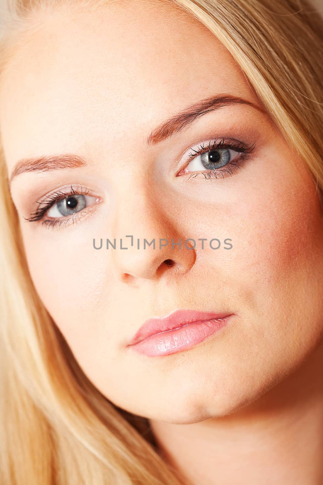 portrait of a beautiful young woman in studio by jannyjus