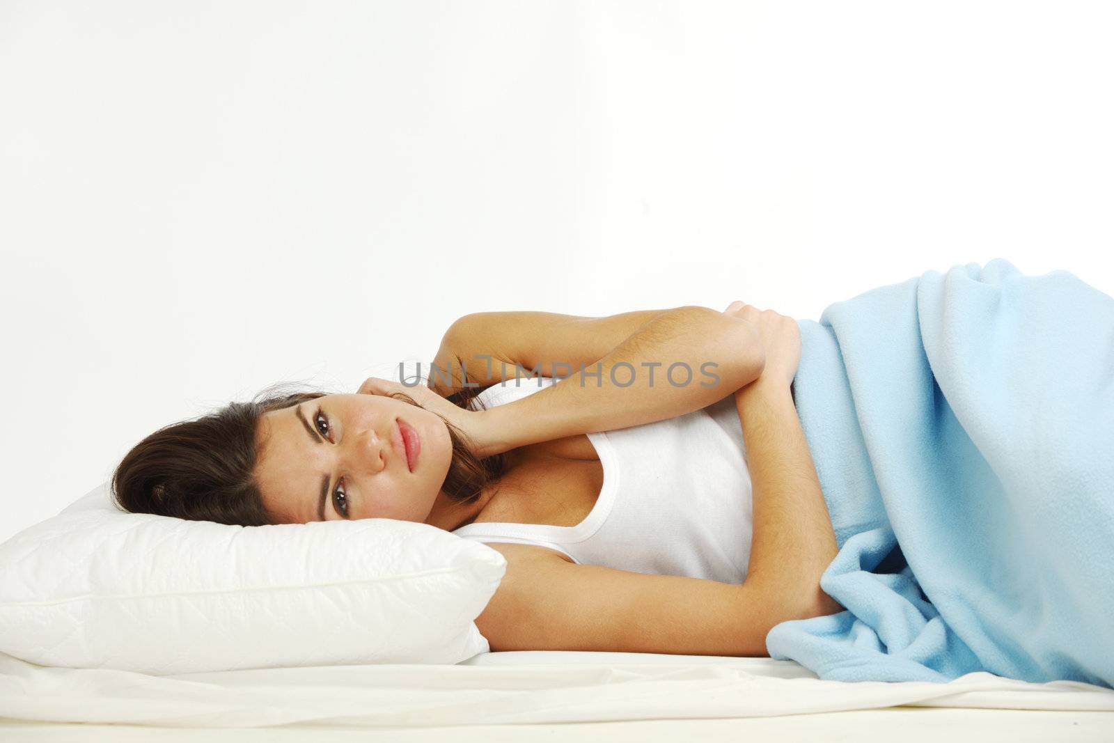 waking woman on the white pillow