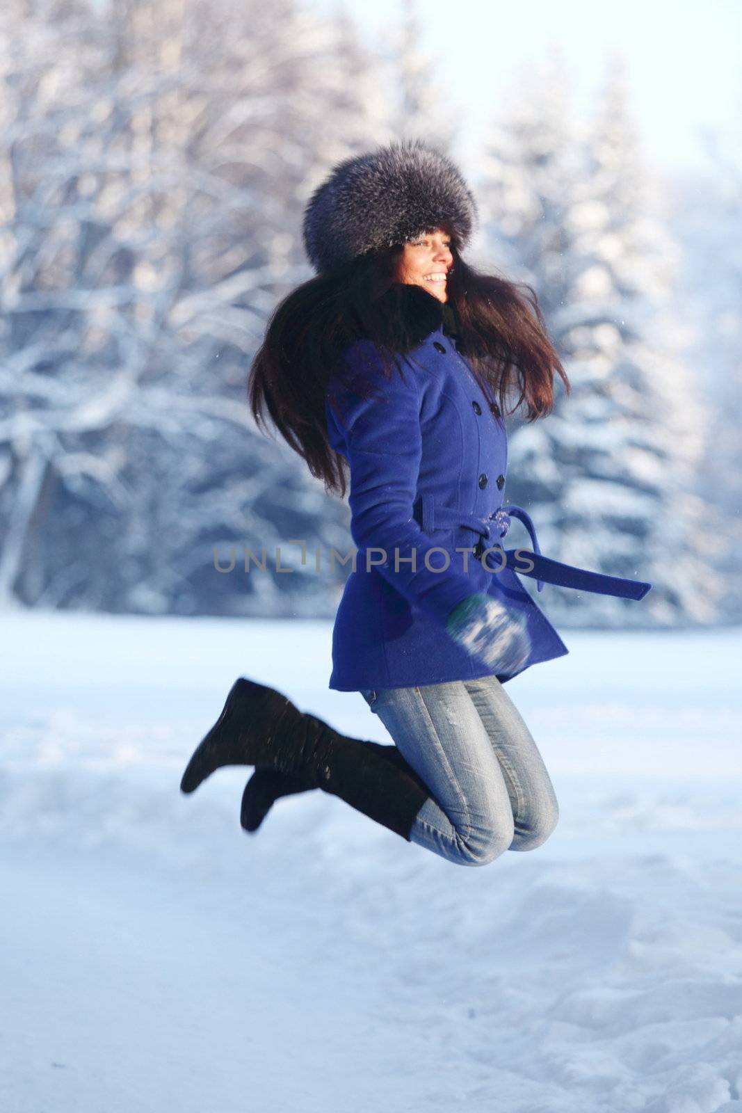 winter women jump in snow