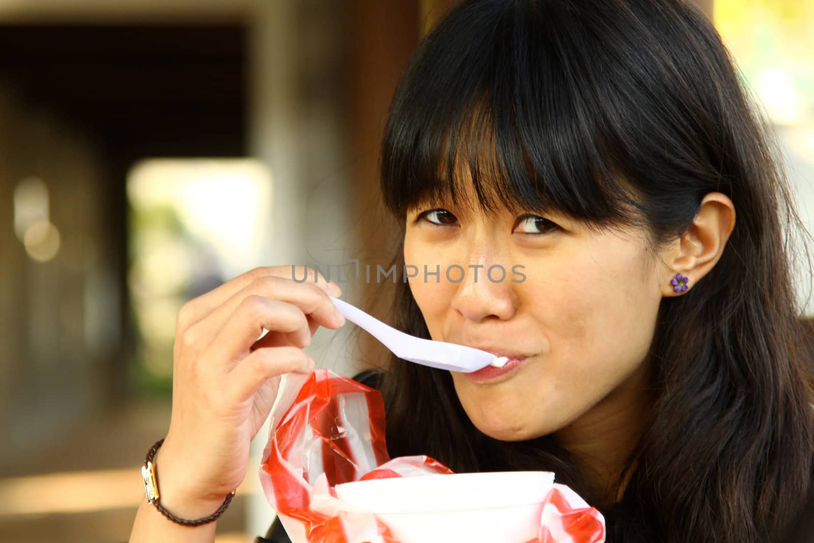 Asian woman eating dessert by kawing921
