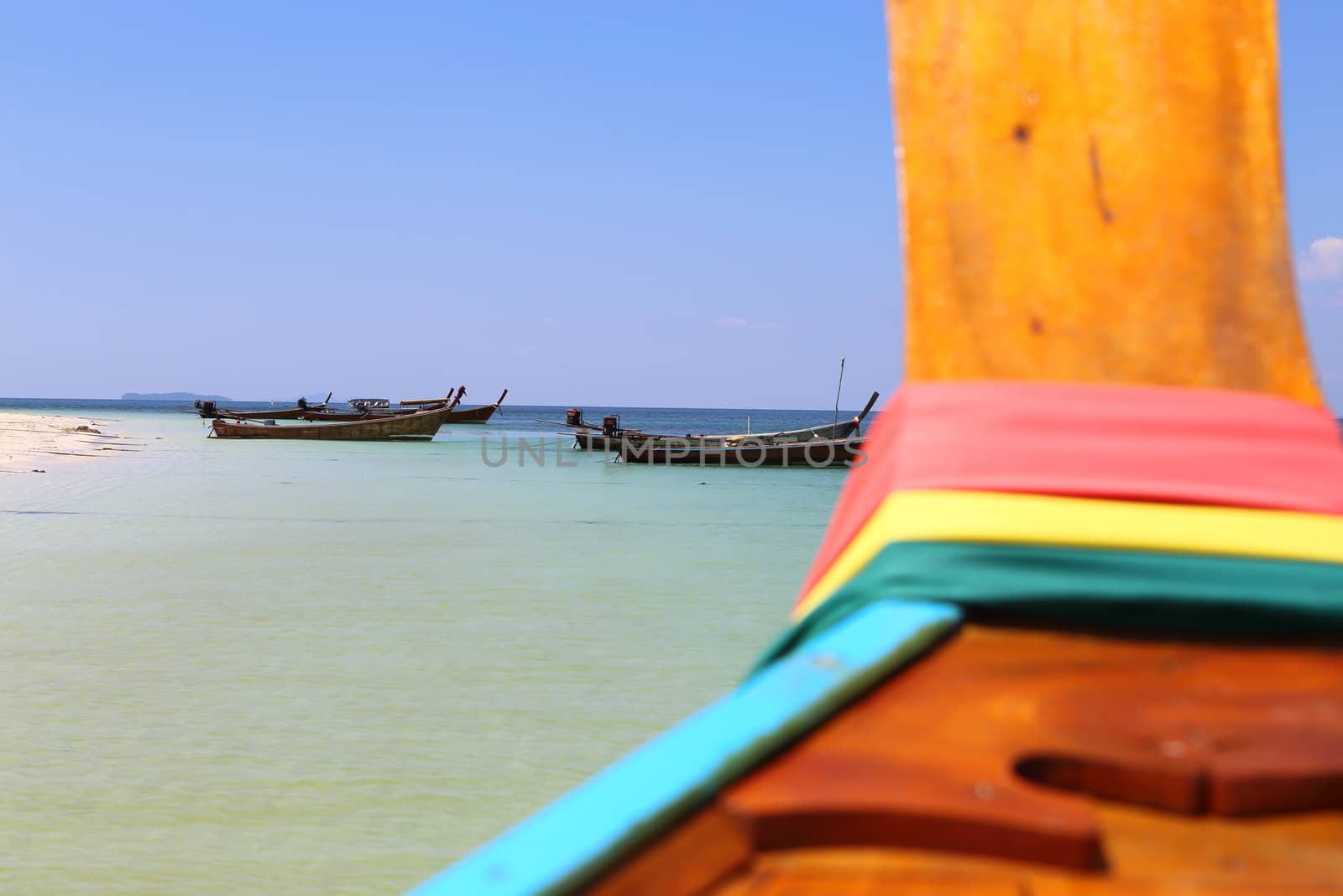 long tail boat sit on the beach,Lipe island, Thailand by rufous