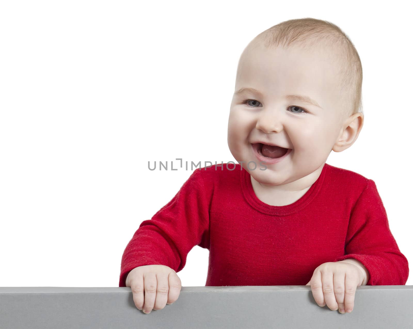 young child with red shirt holding shield. isolate on white background