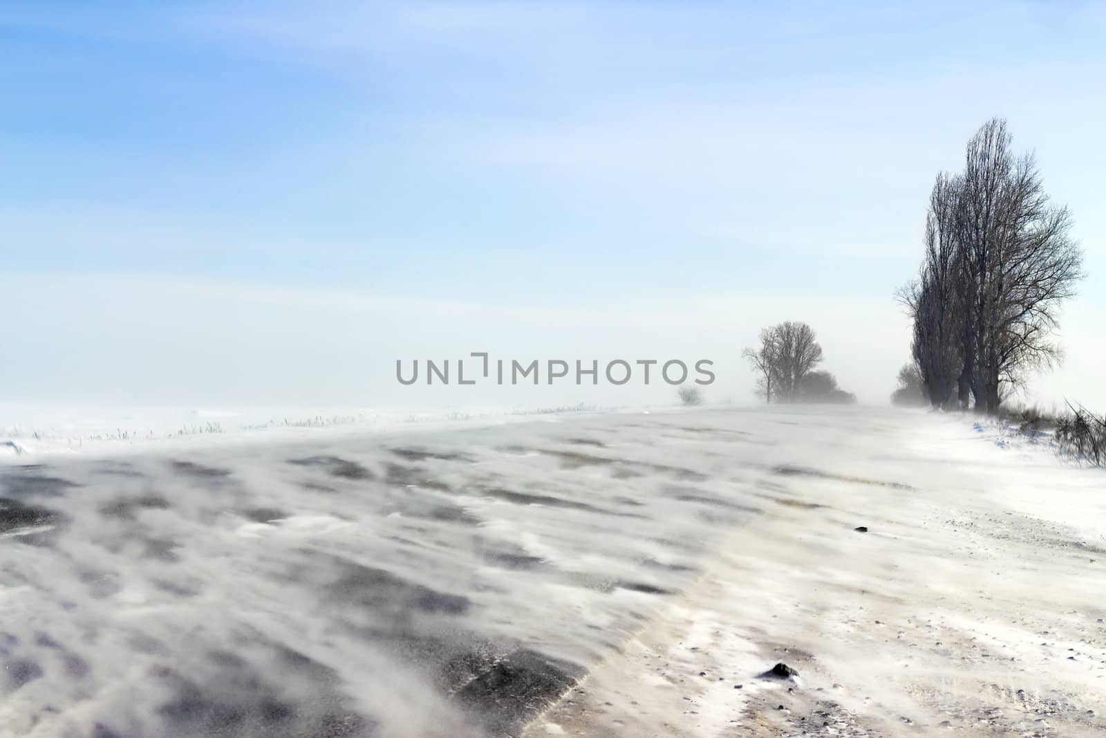 a snowstorm on a highway in the background